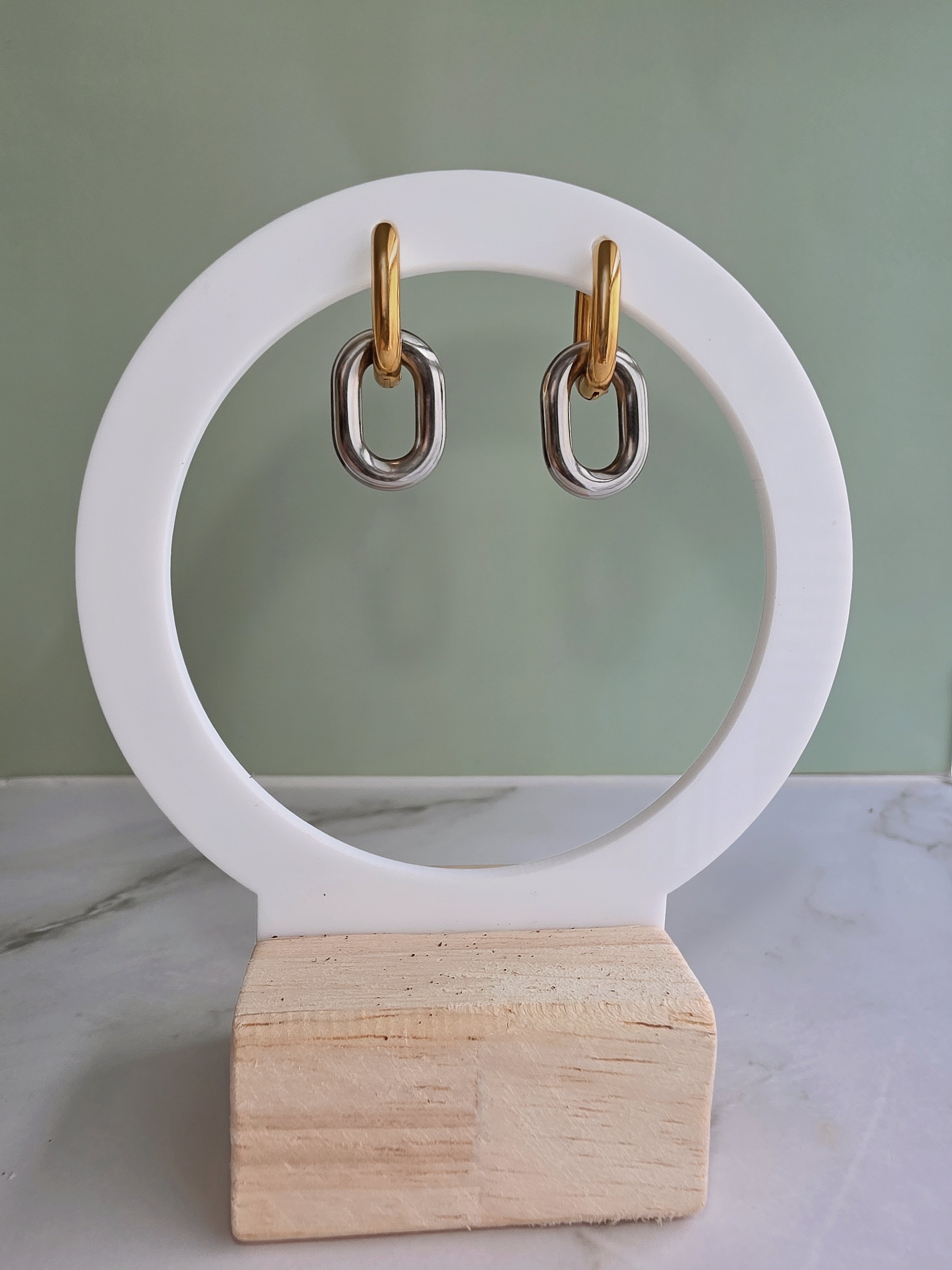 Modern gold and silver huggie earrings with a non tarnish finish.