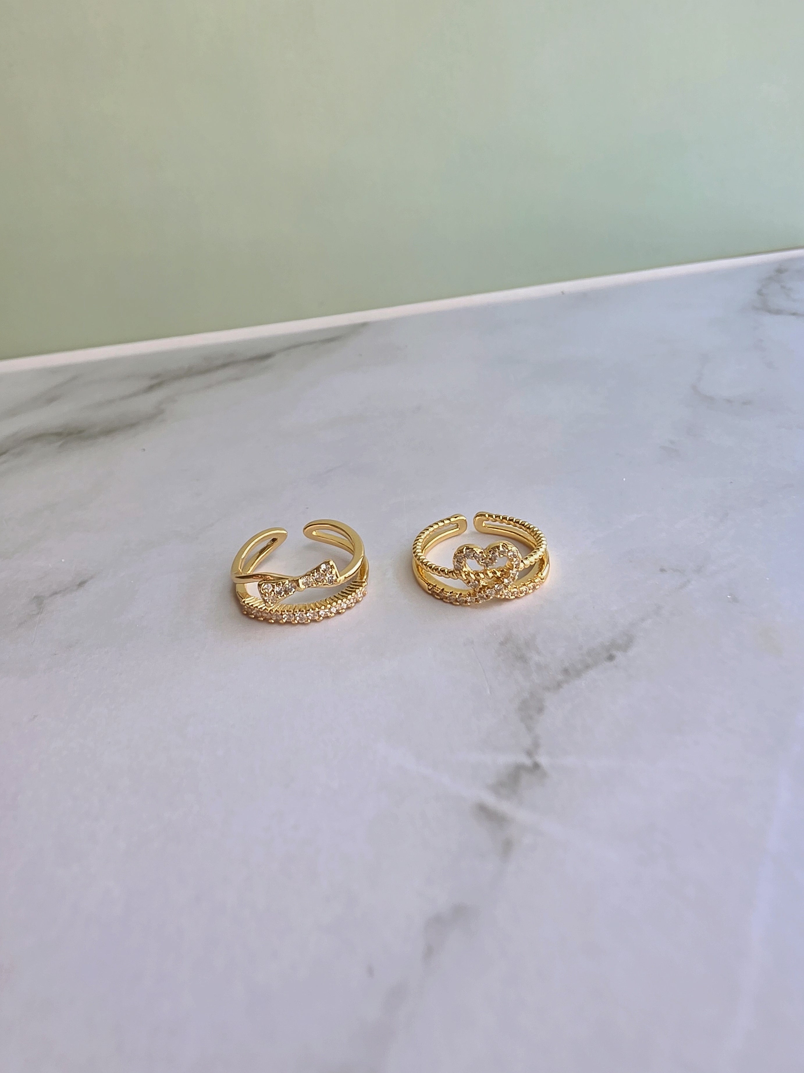 Minimalist 14K gold plated toe rings with an open adjustable design for a comfortable fit.