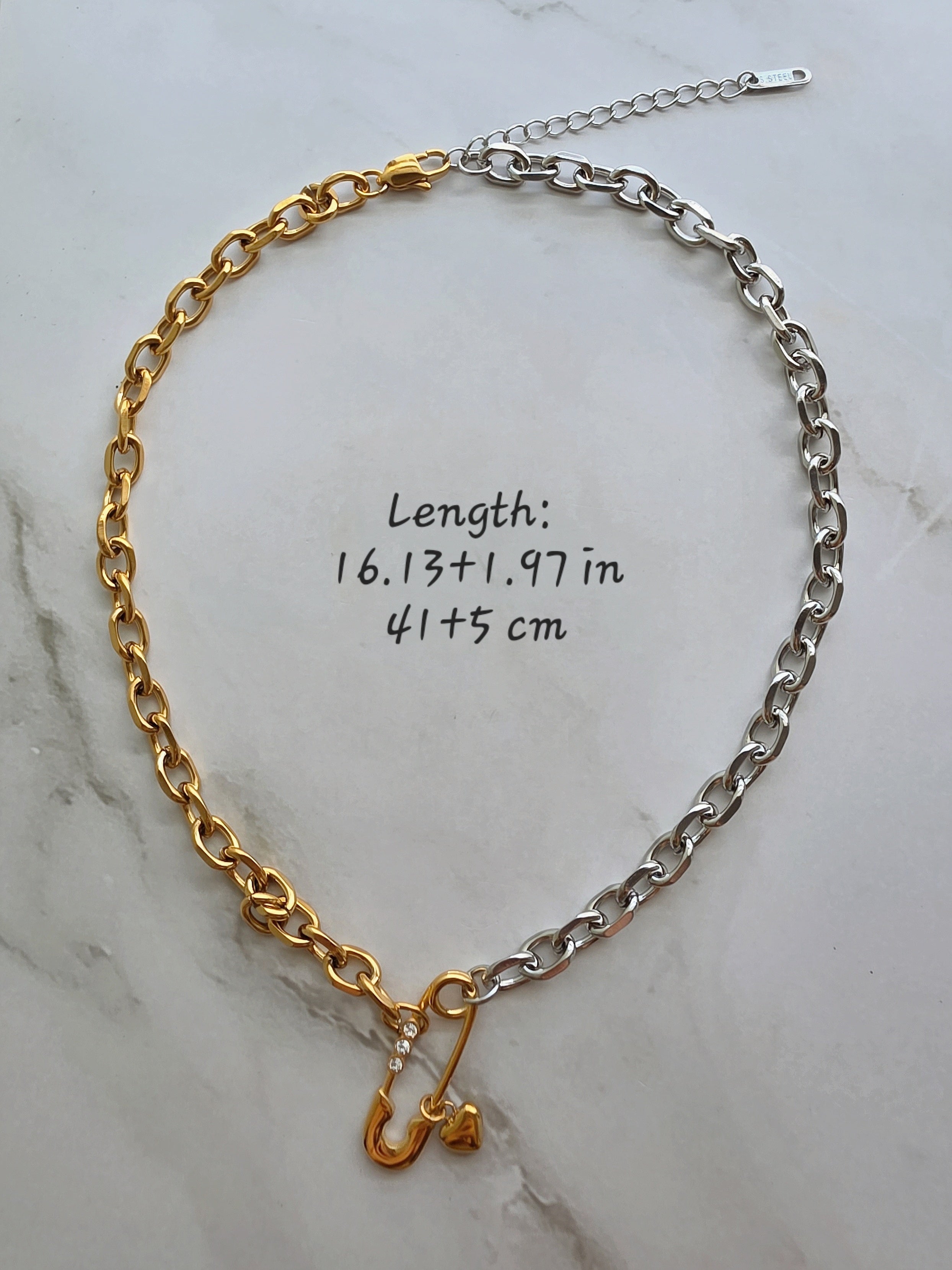 Two-tone safety pin necklace and bracelet set for everyday wear.