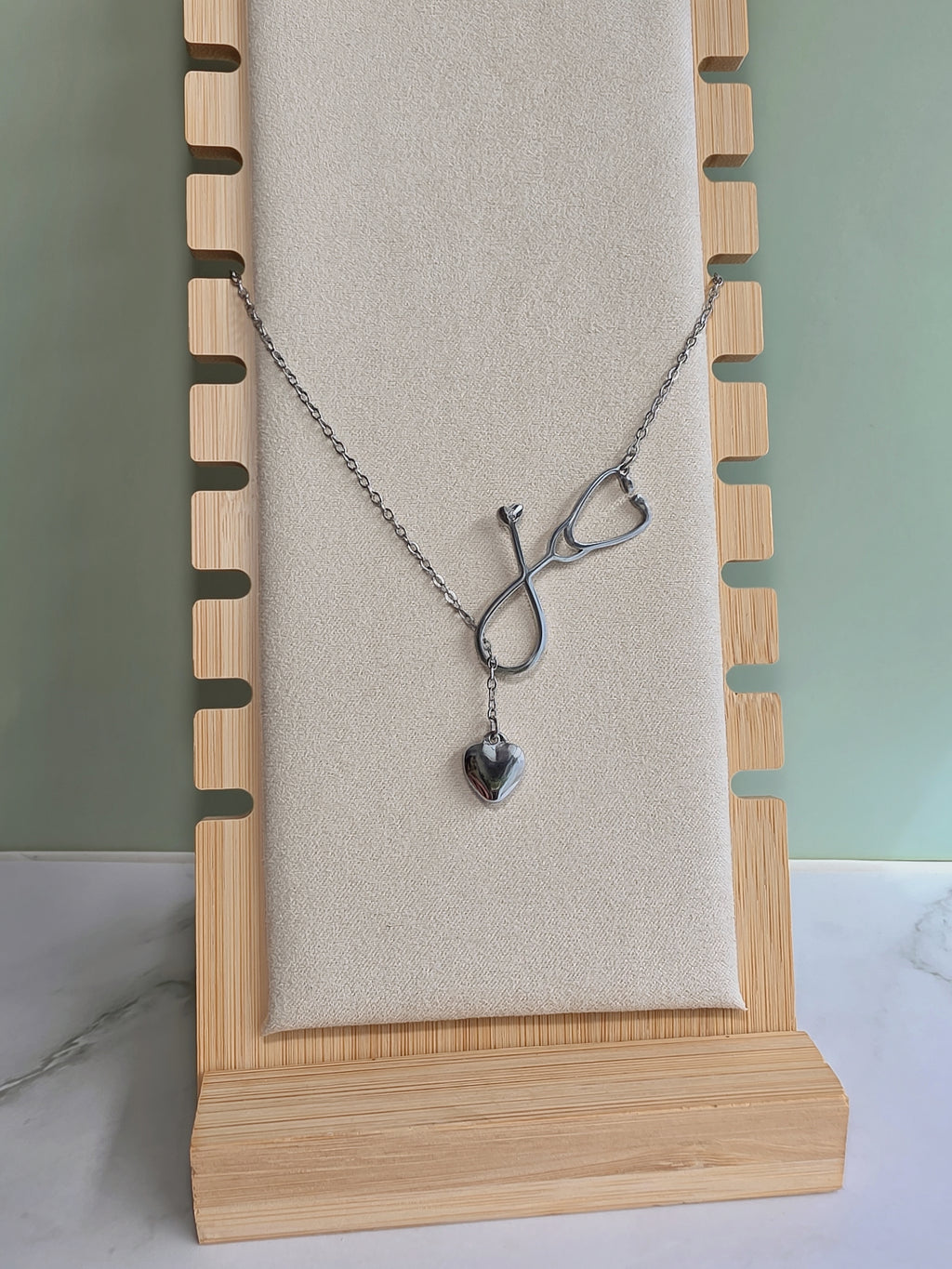 Elegant doctor necklace with a heart-shaped stethoscope.