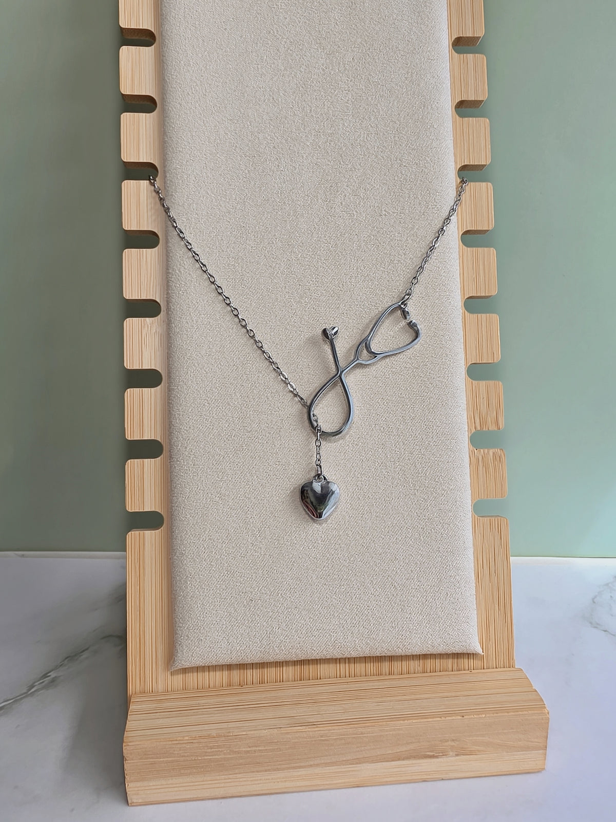 Elegant doctor necklace with a heart-shaped stethoscope.