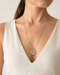 Heart urn necklace for ashes in an 18K gold-plated finish.