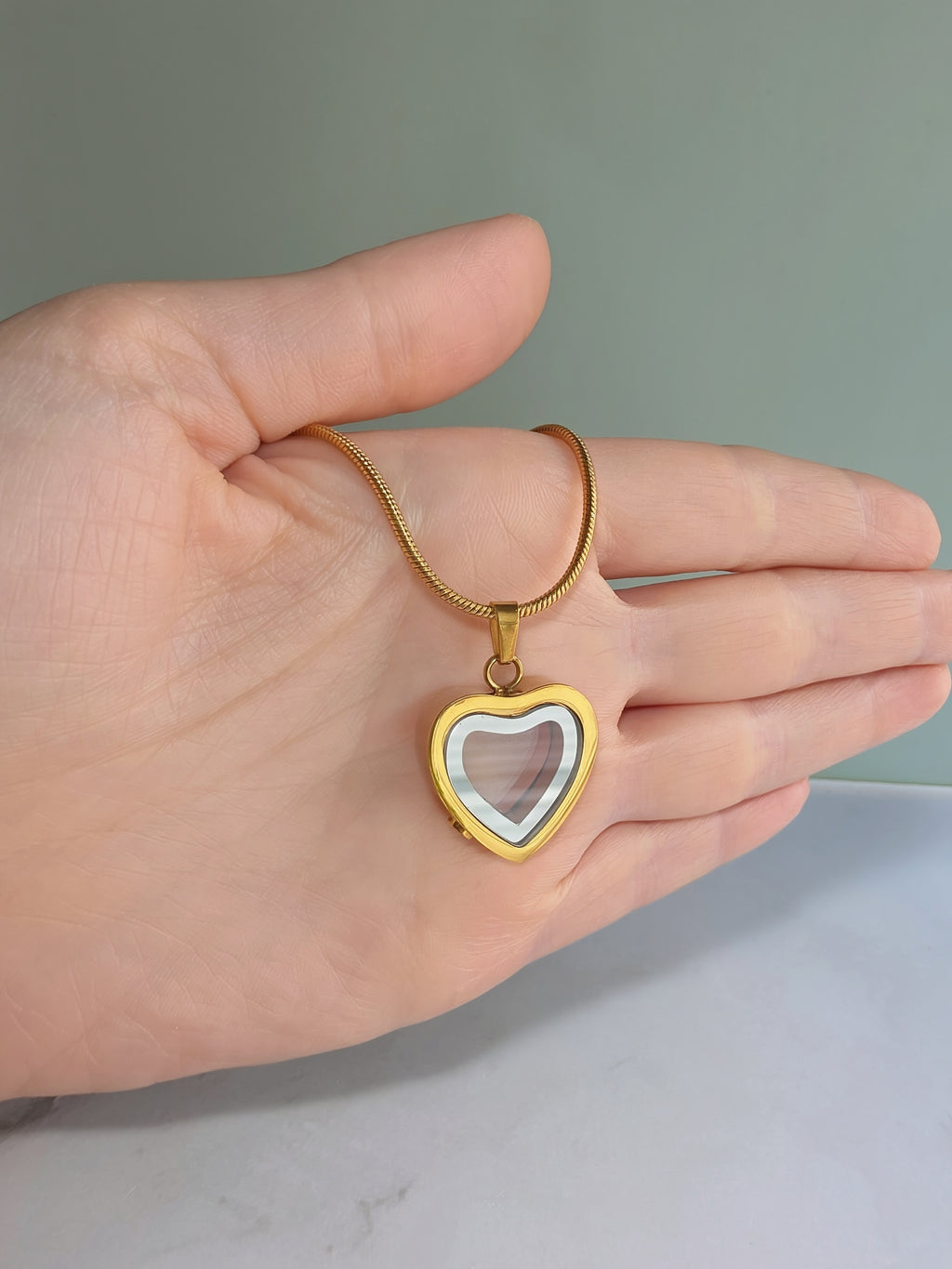 Cremation jewelry heart necklace for remembrance.