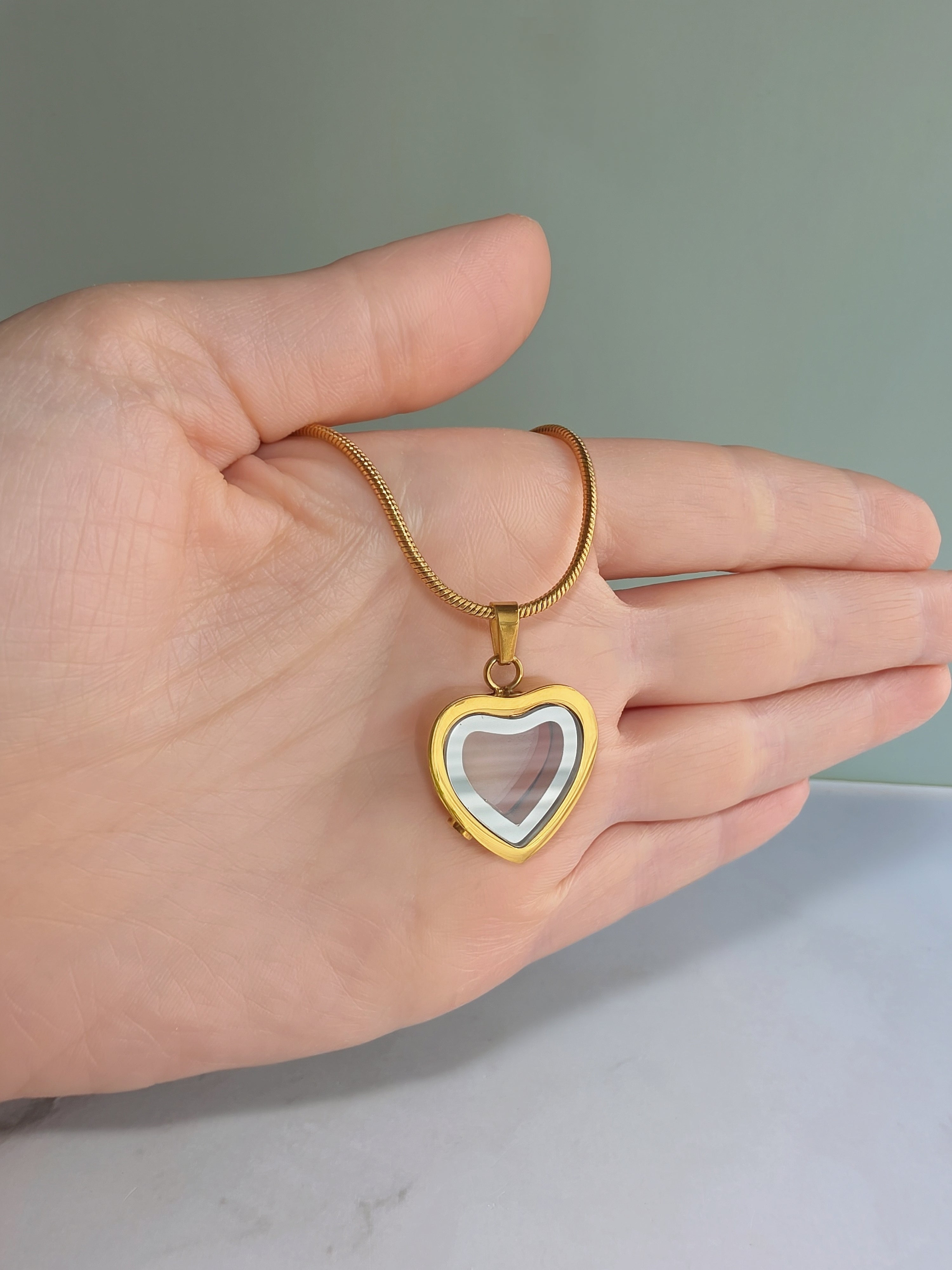 Cremation jewelry heart necklace for remembrance.