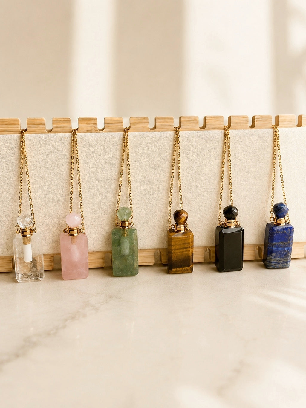 14K gold-plated vial necklace with a natural gemstone perfume bottle pendant.