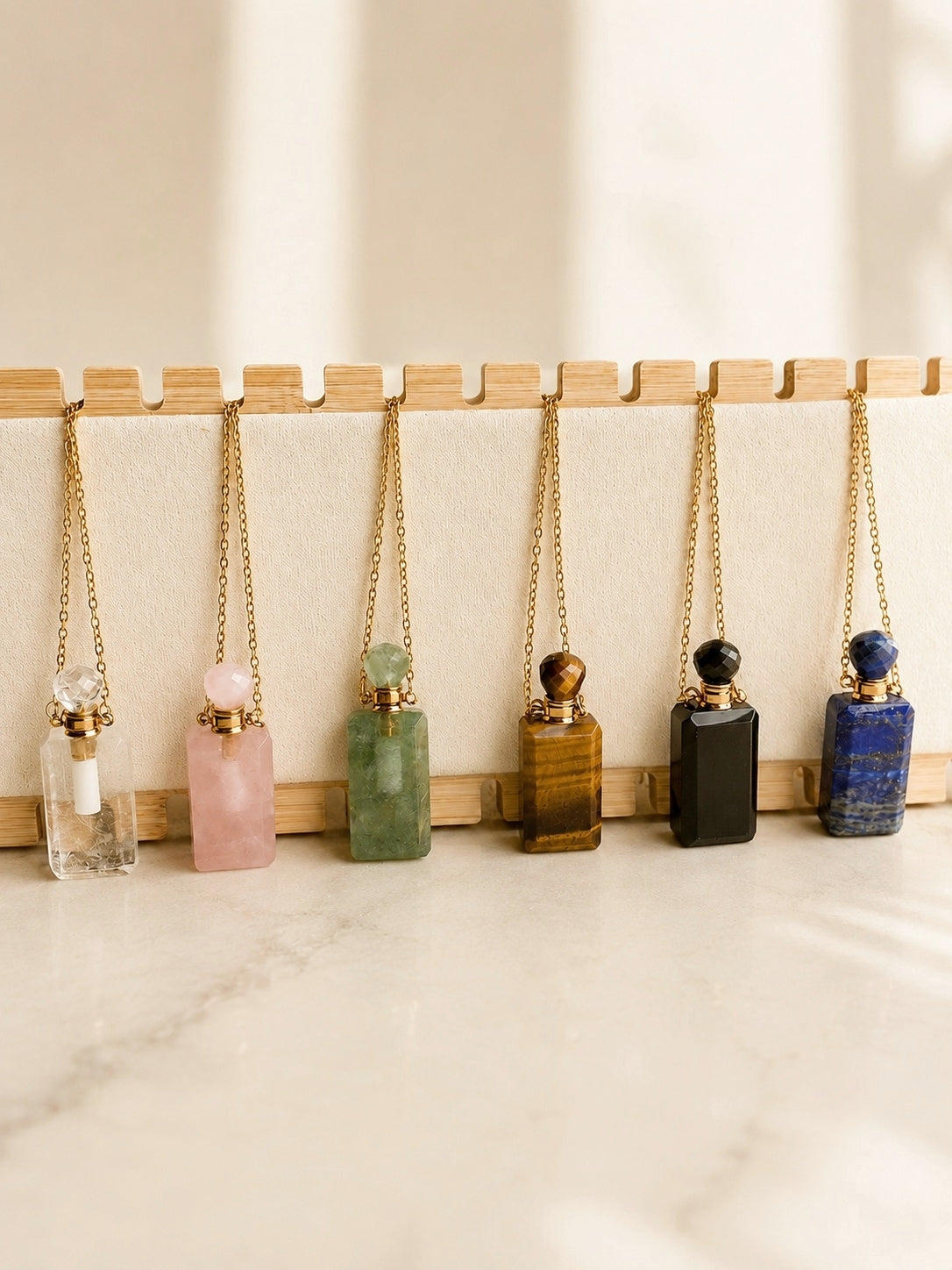 14K gold-plated vial necklace with a natural gemstone perfume bottle pendant.
