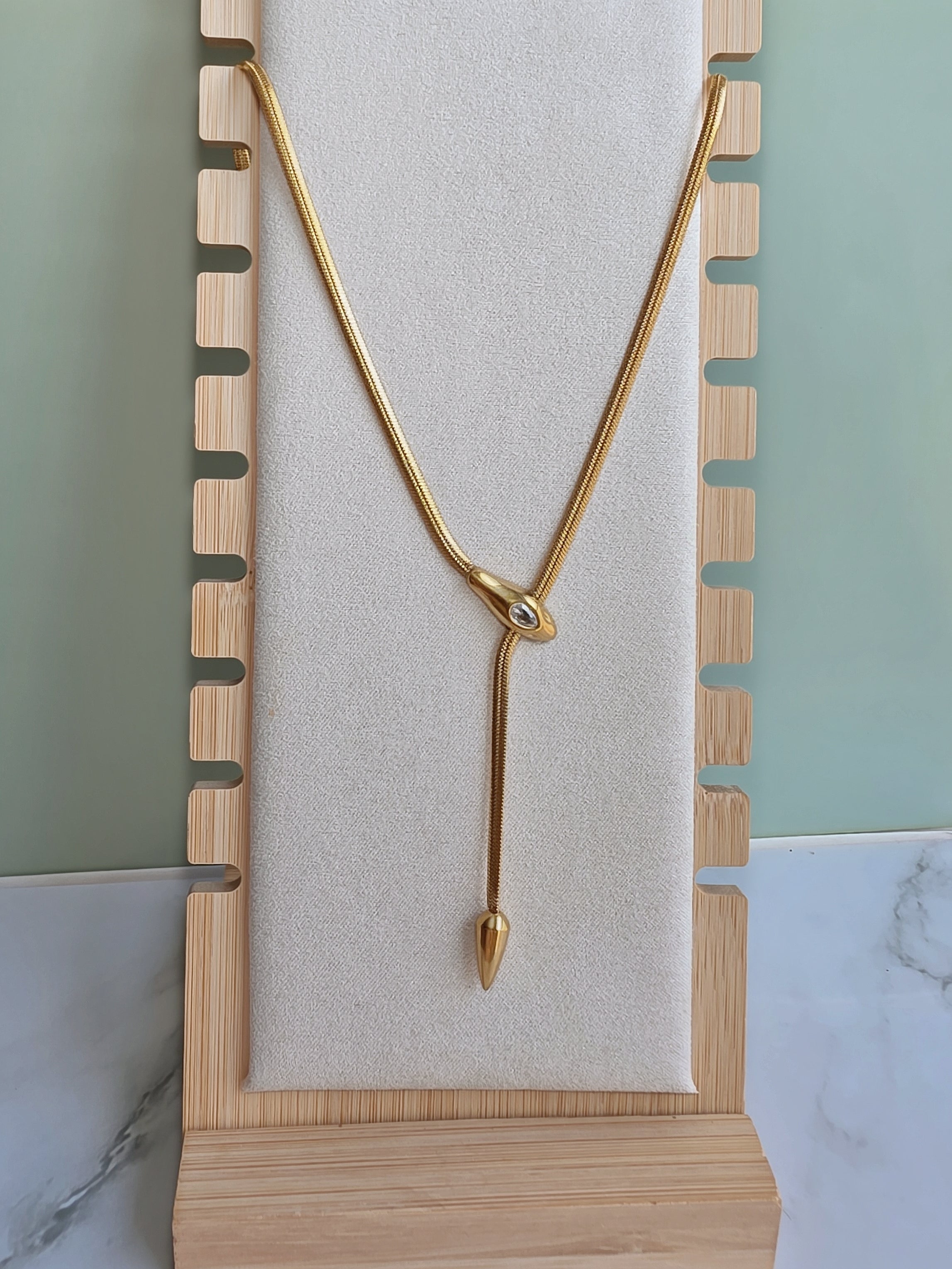 Gold Y necklace with a sleek snake chain design.