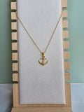Gold anchor necklace for everyday wear.