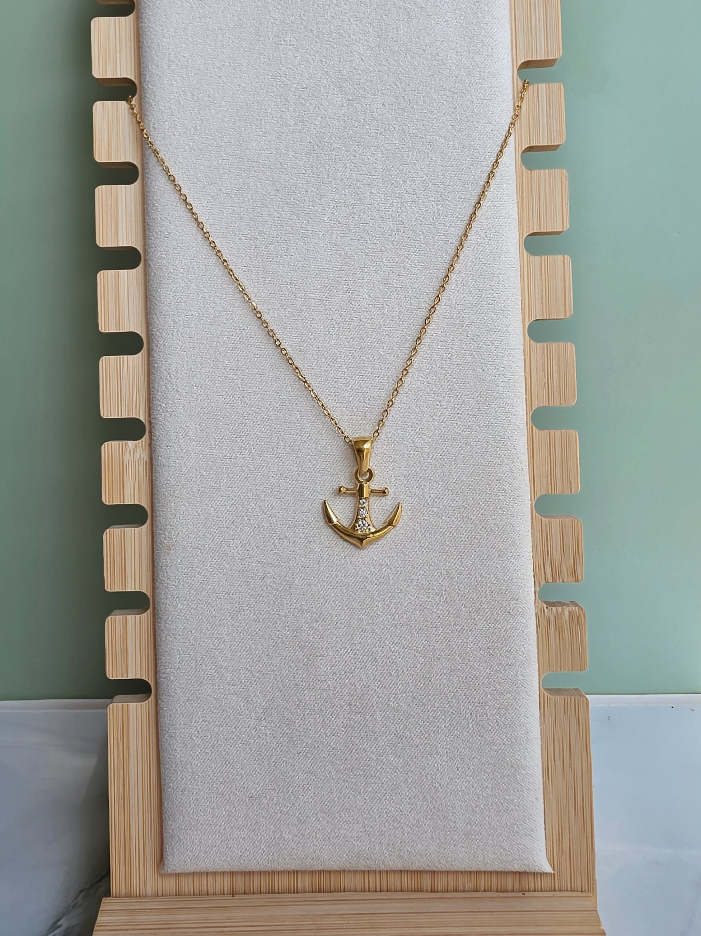 Gold anchor necklace for everyday wear.