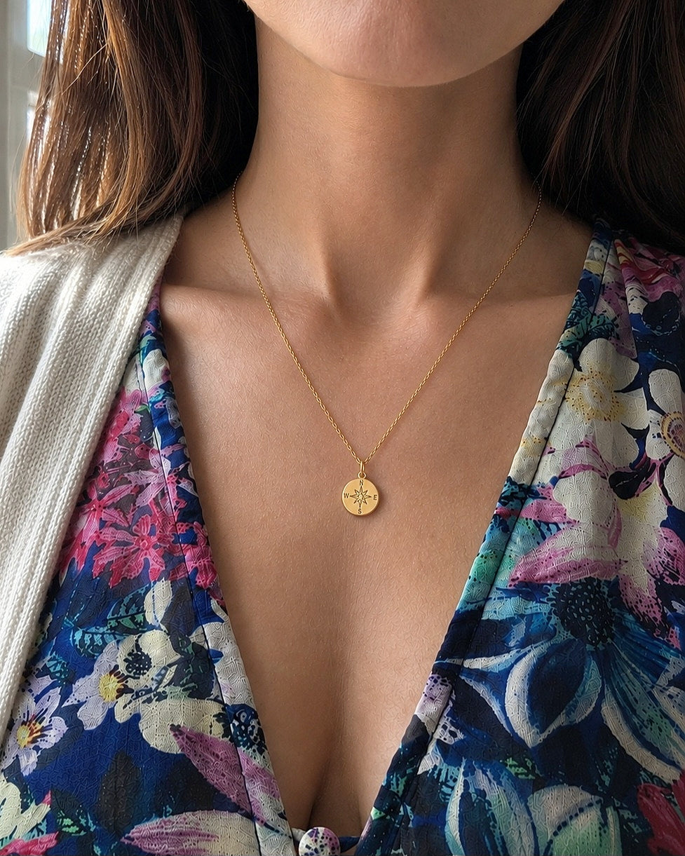 Compass necklace with engraved North Star pendant.
