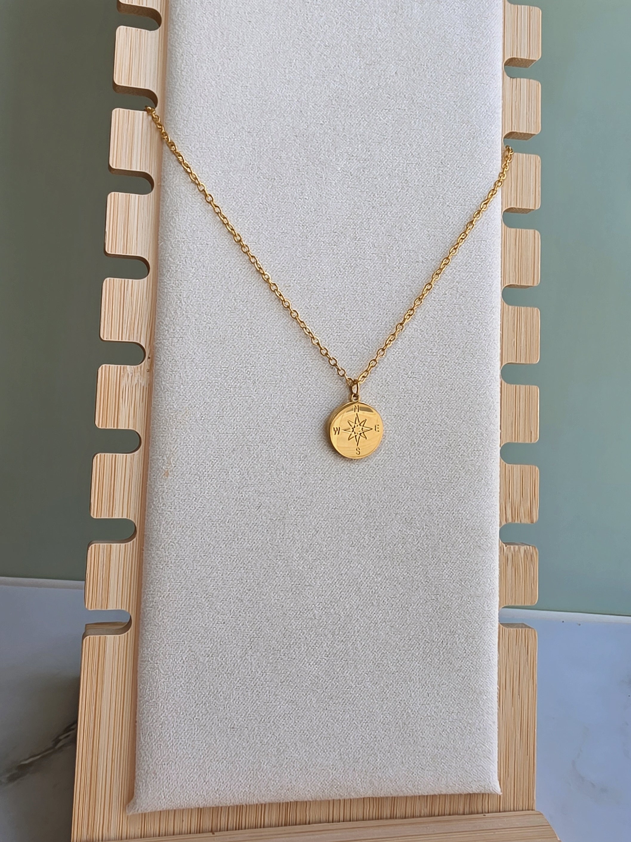 North Star compass necklace symbolizing guidance.