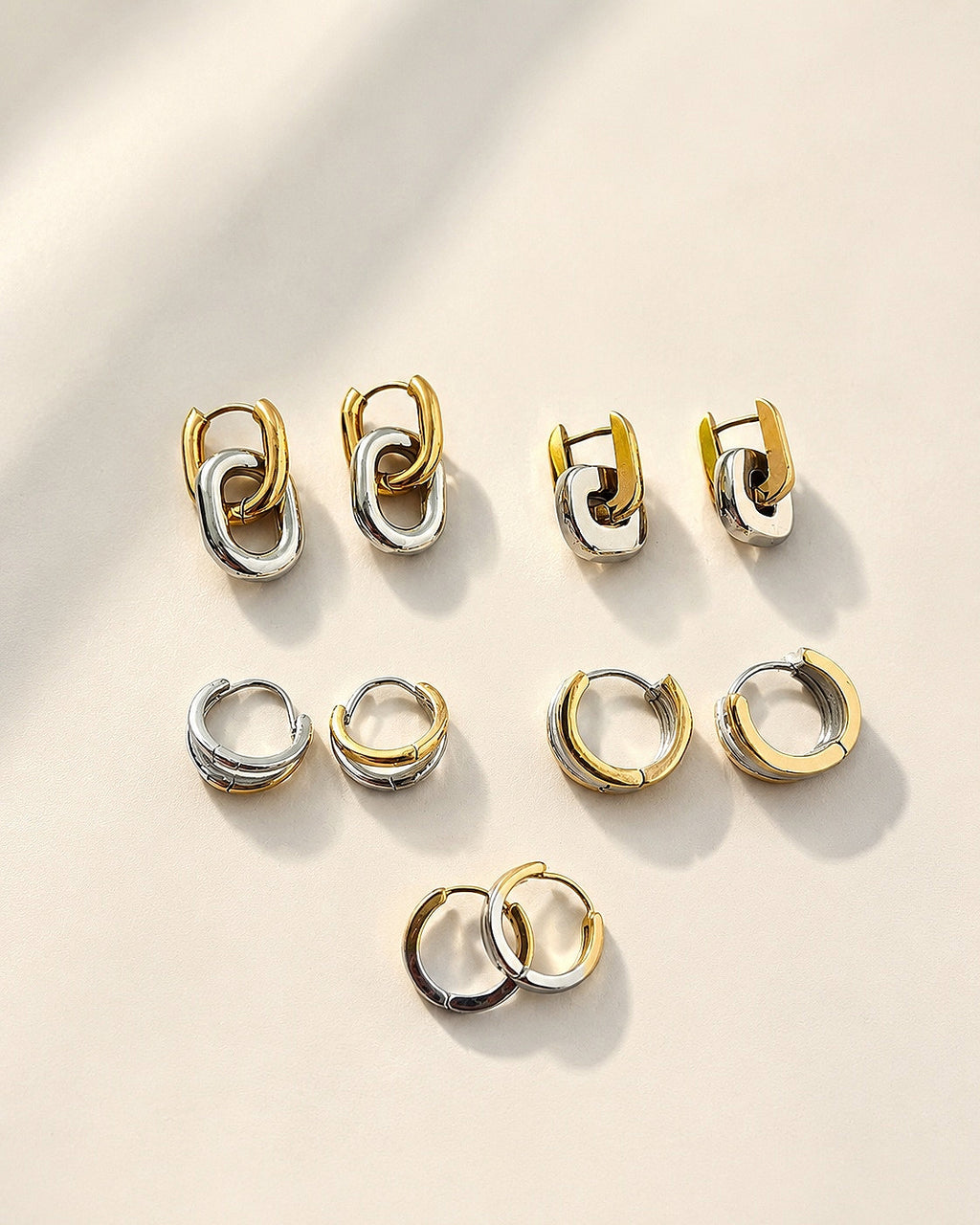 Non tarnish mixed metal earrings with a two-tone gold and silver design.