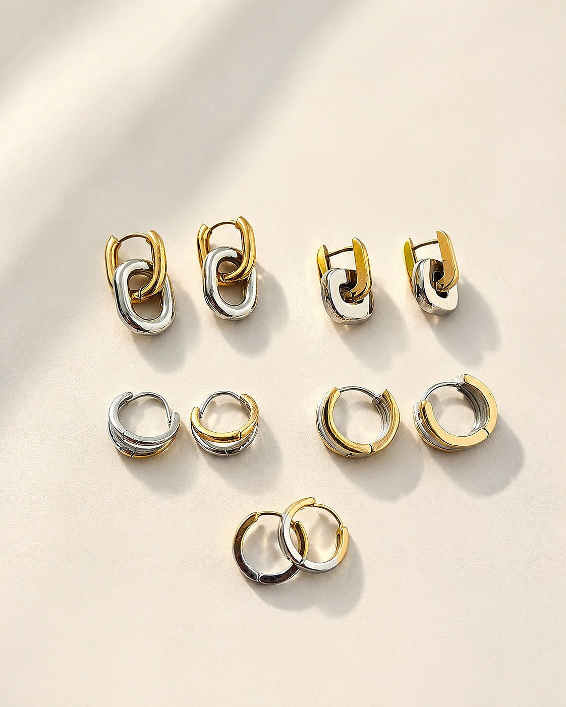 Non tarnish mixed metal earrings with a two-tone gold and silver design.