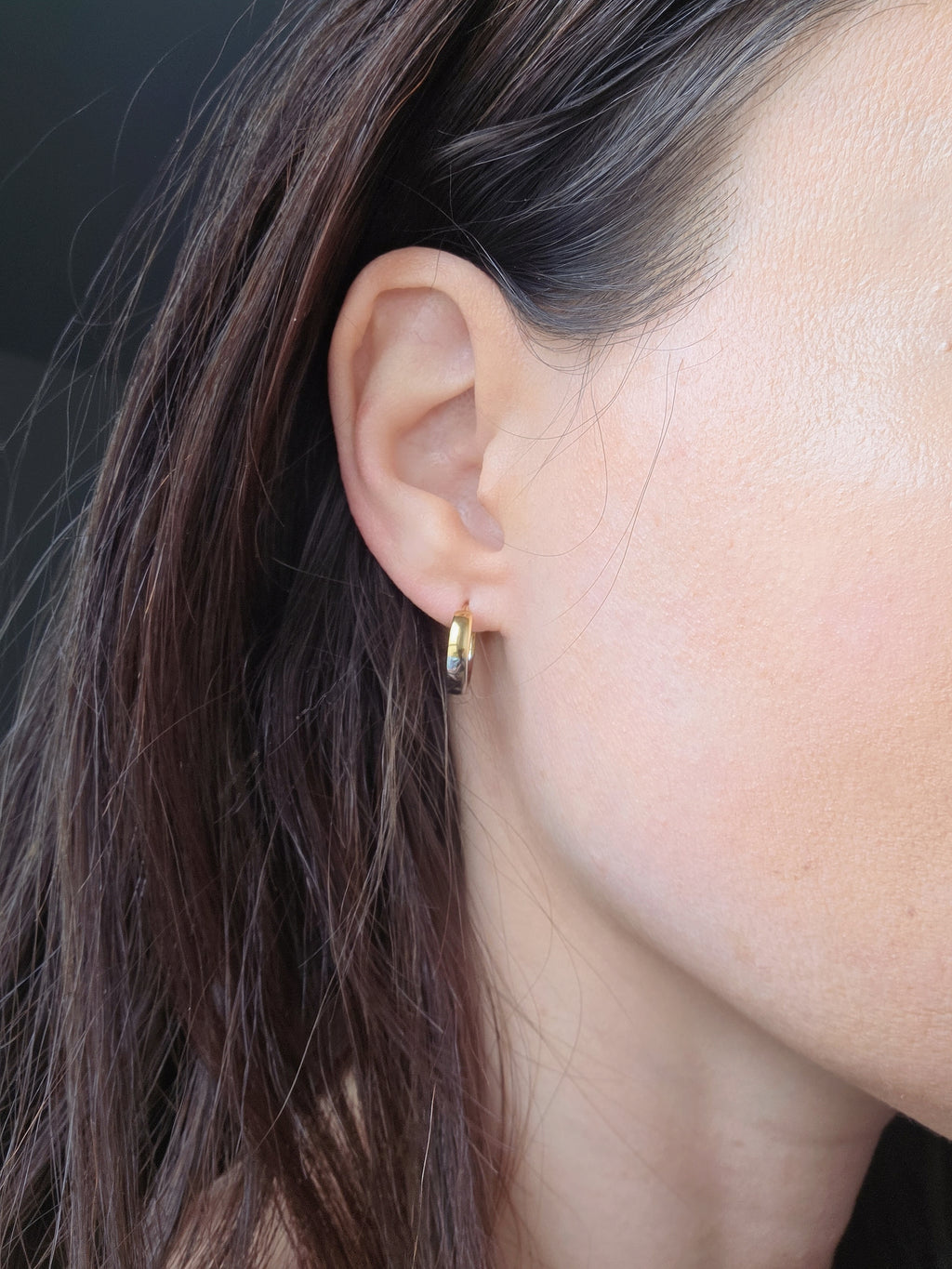 Minimalist mixed metal earrings in gold and silver finishes.