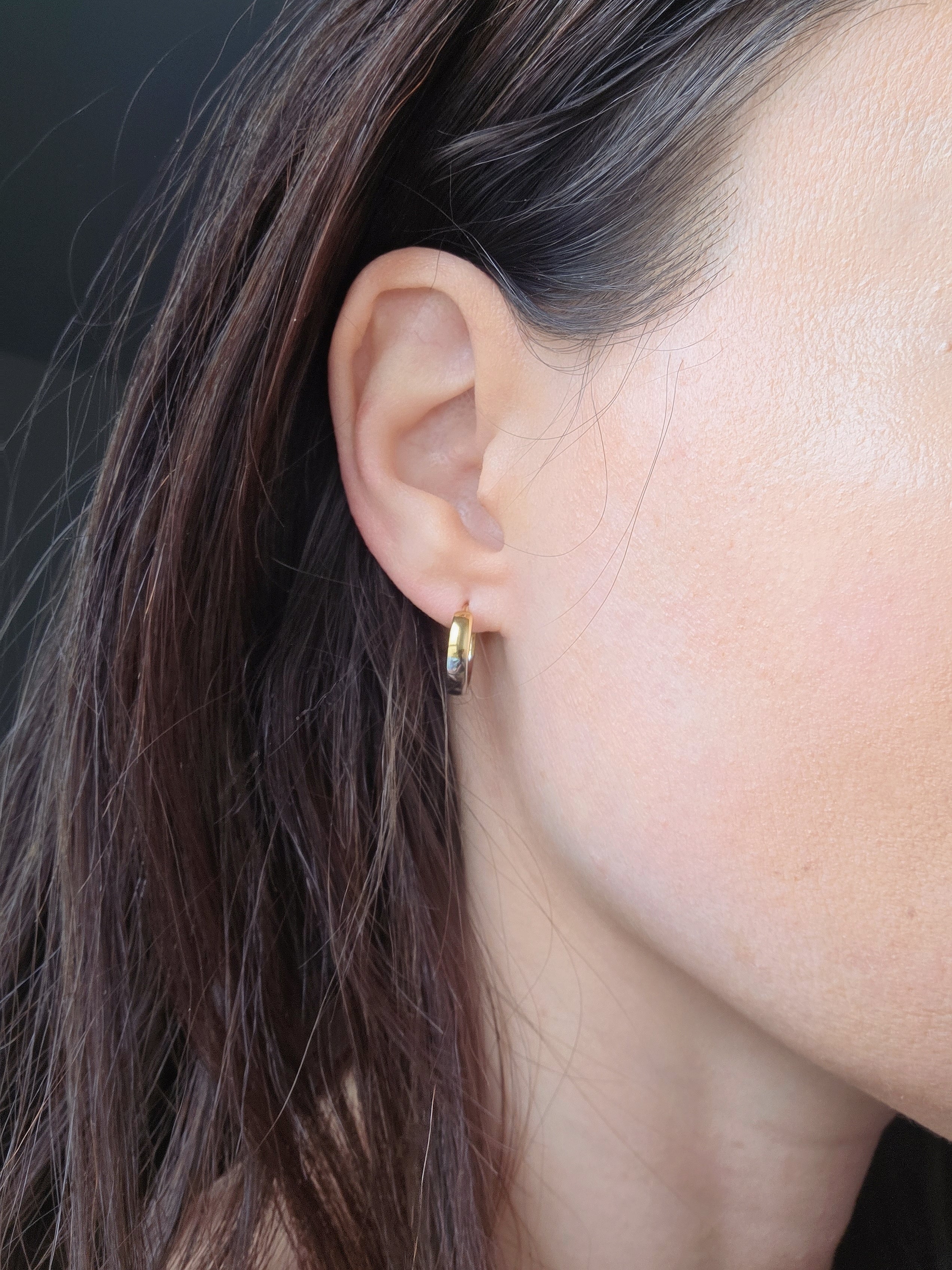 Minimalist mixed metal earrings in gold and silver finishes.