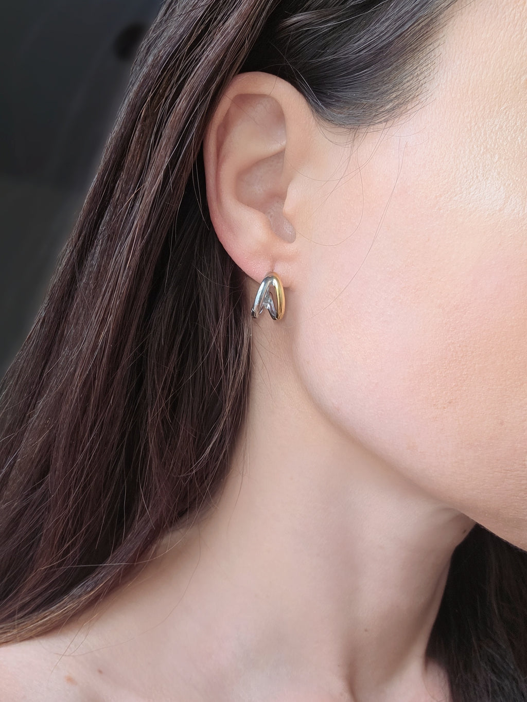 Contemporary mixed metal huggie earrings for everyday style.