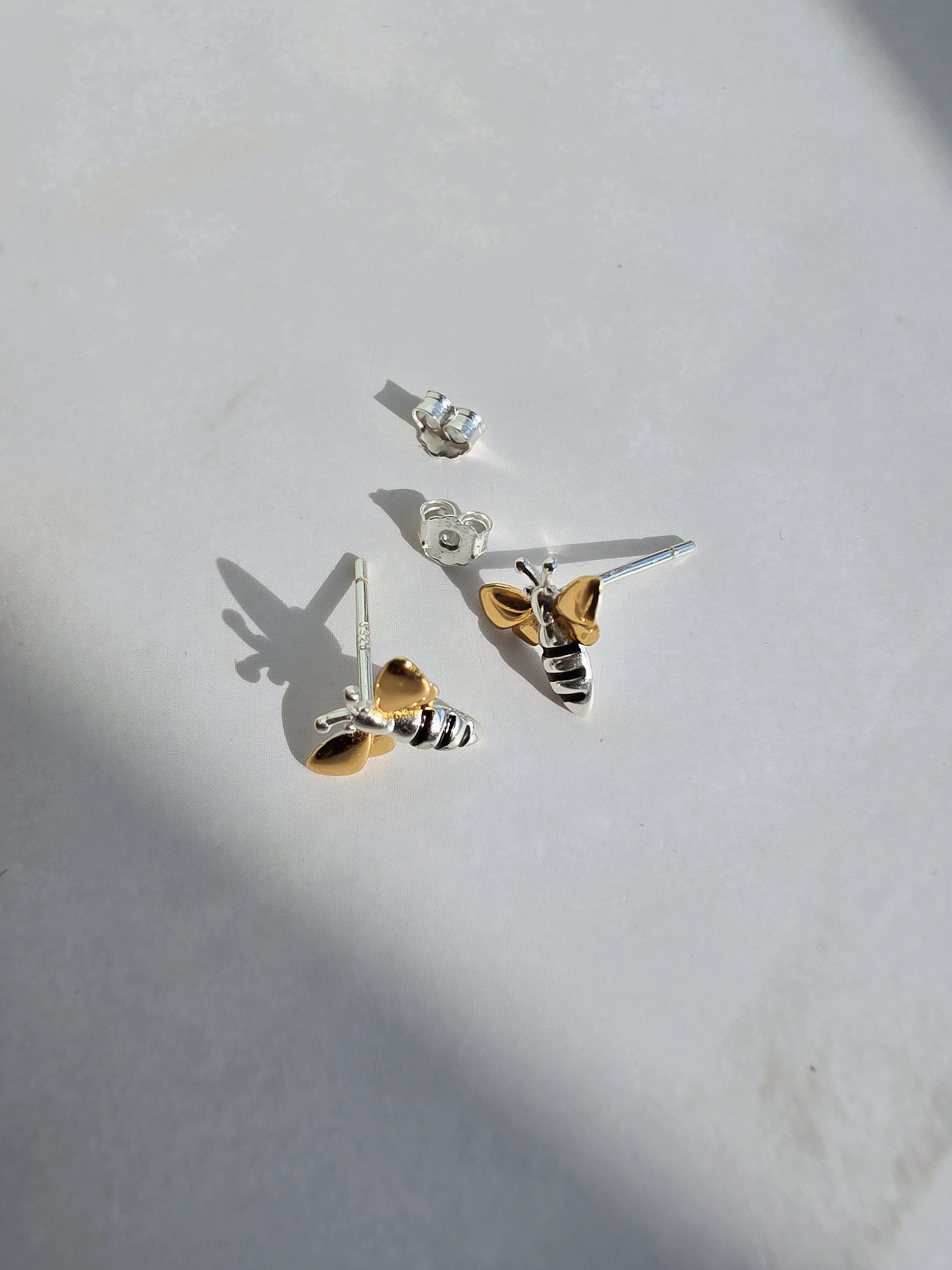 Gold wing bee earrings in sterling silver.