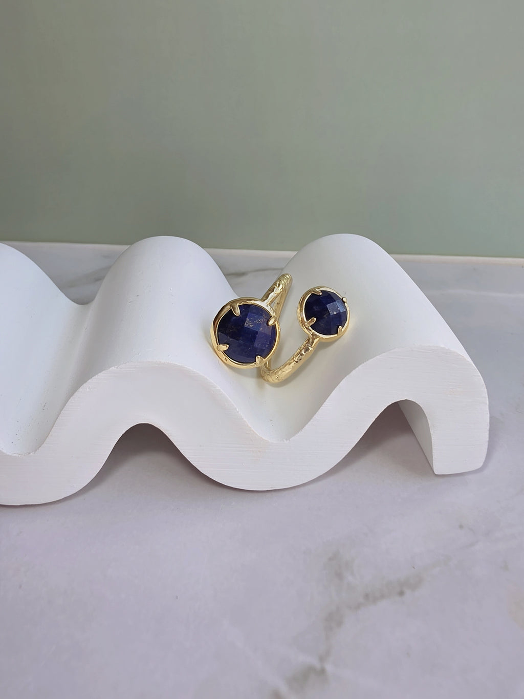 Adjustable blue stone ring.