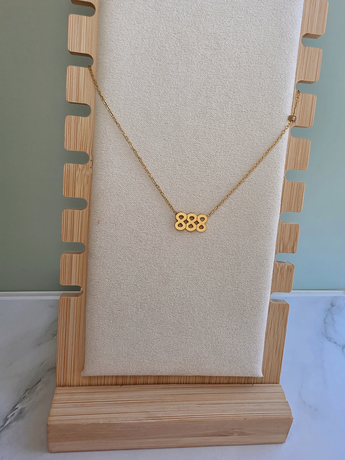 Inspirational number necklace featuring elegant 888 pendant.