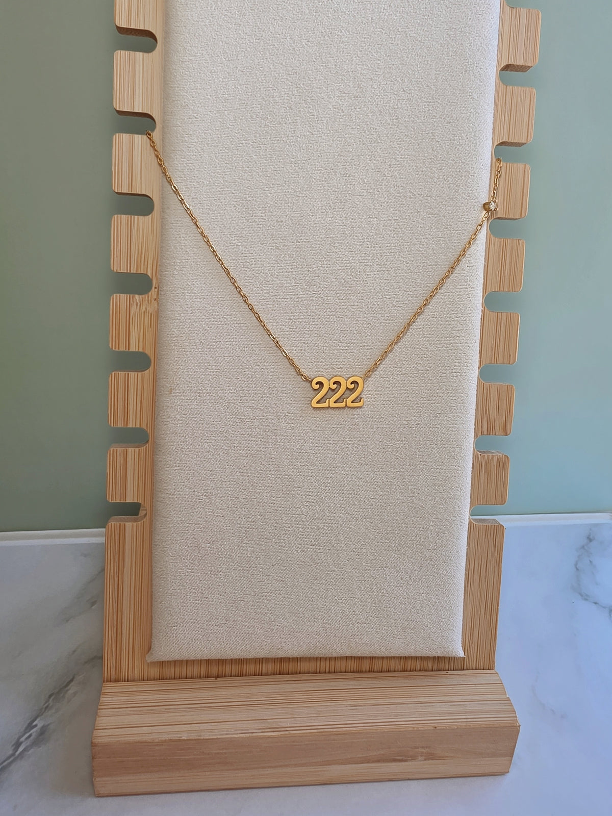 Spiritual angel number necklace with polished 222 pendant.