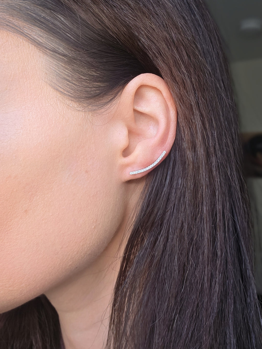 Gold plated ear climber earrings with shimmering cubic zirconia.