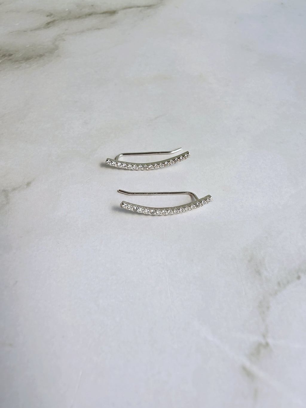 Modern ear crawler earrings in sterling silver.