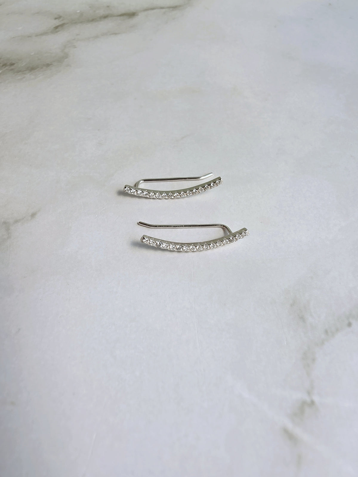 Modern ear crawler earrings in sterling silver.