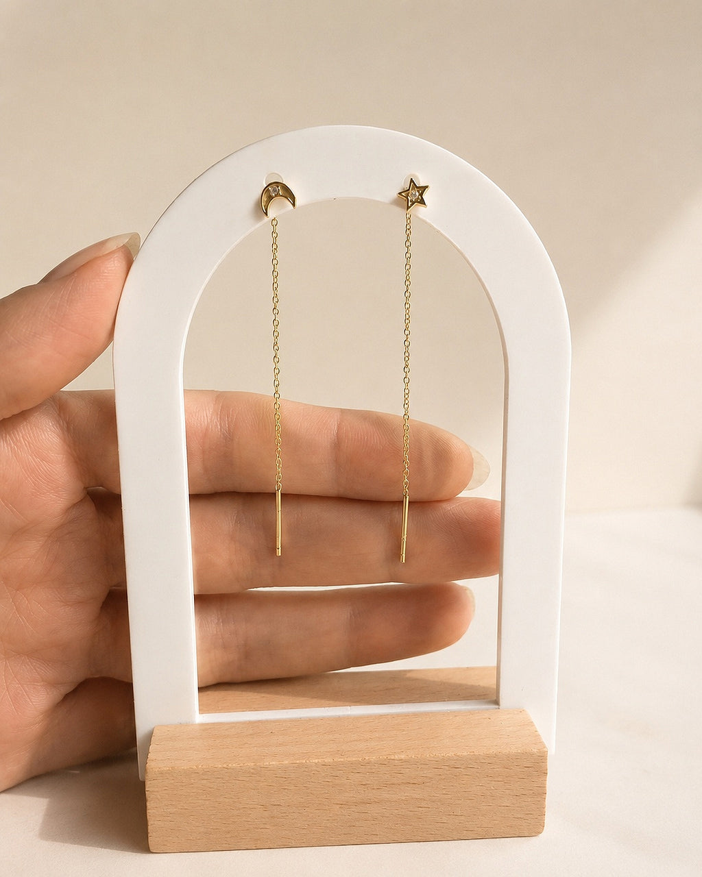 Gold moon and star threader earrings with sparkling crystals.