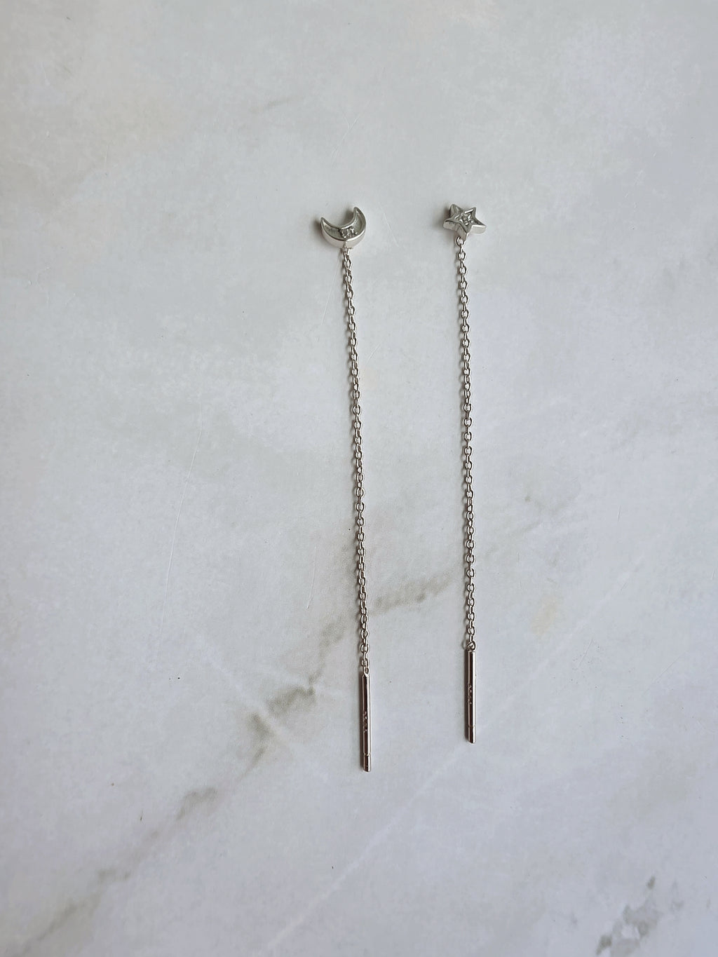 Lightweight moon and star threader earrings in silver.