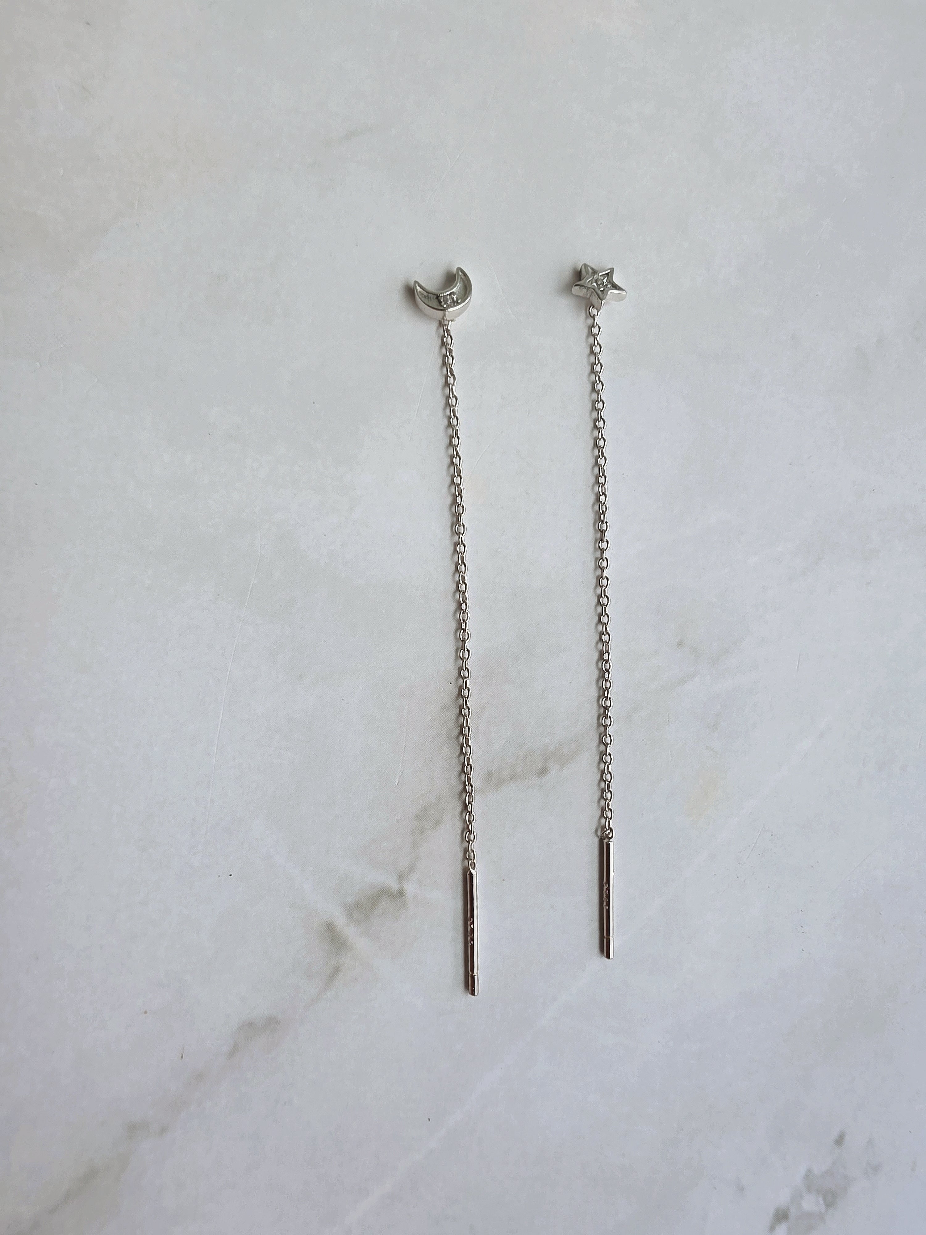 Lightweight moon and star threader earrings in silver.