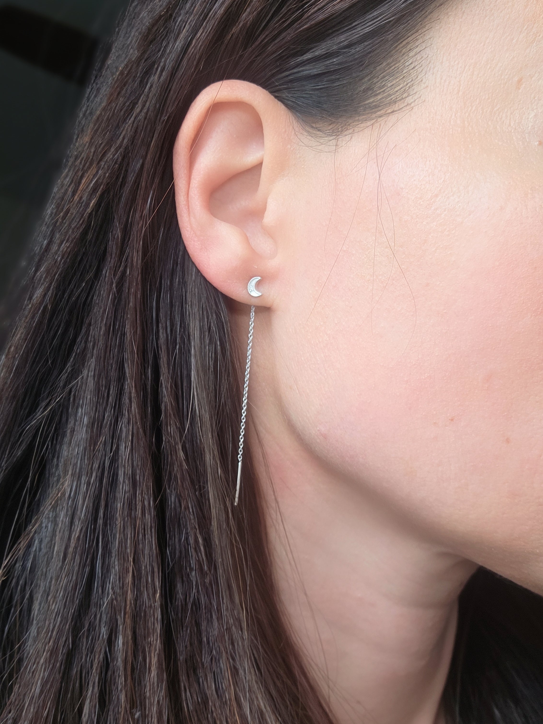 Dainty celestial earrings in gold with sparkling cubic zirconia.