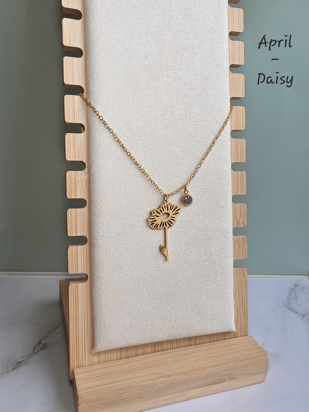 Waterproof personalized birth flower necklace with engraved botanical charm.