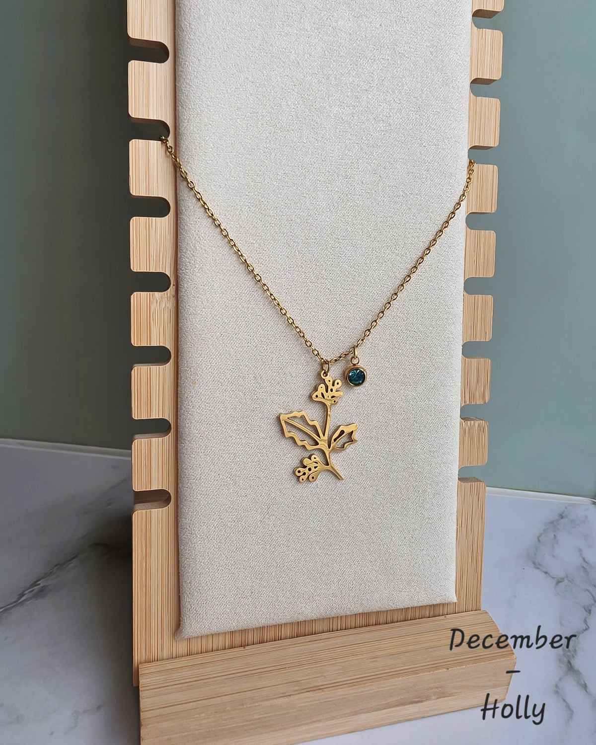 Elegant waterproof birth month necklace with engraved flower and matching birthstone.