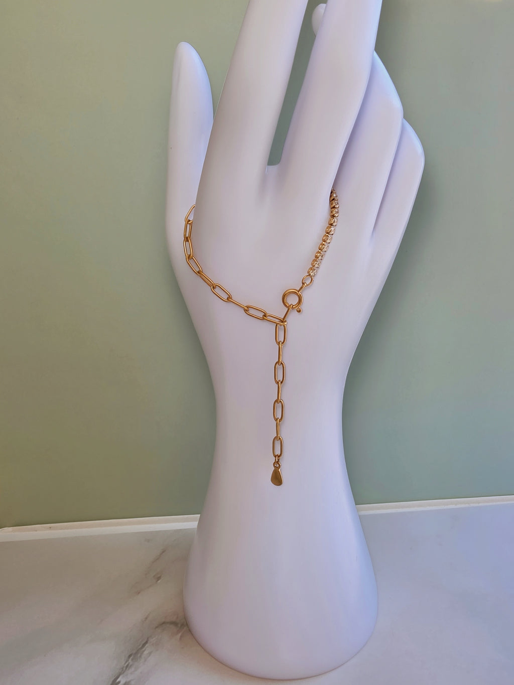 Gold stainless steel tennis bracelet with CZ crystals.