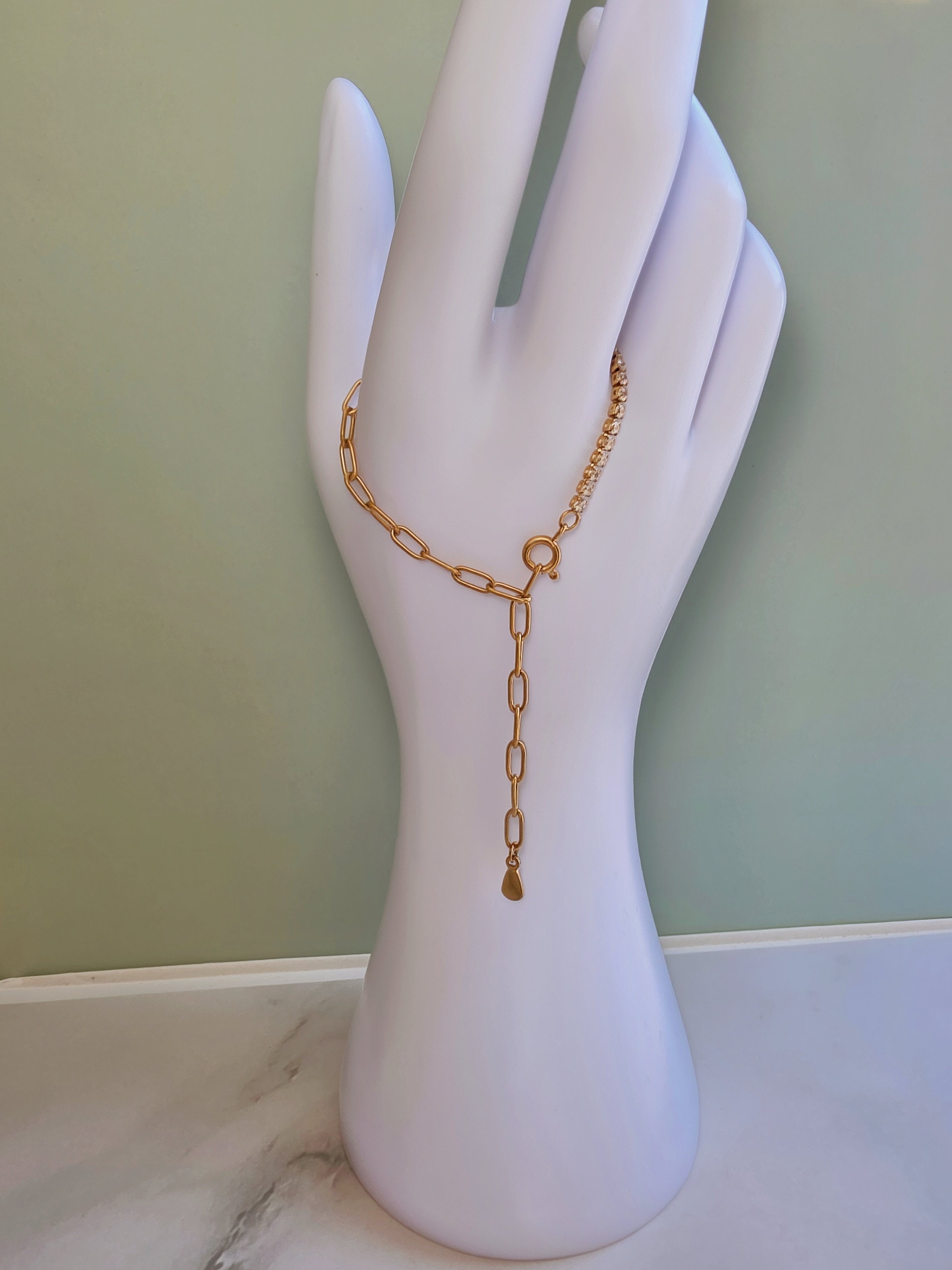 Gold stainless steel tennis bracelet with CZ crystals.