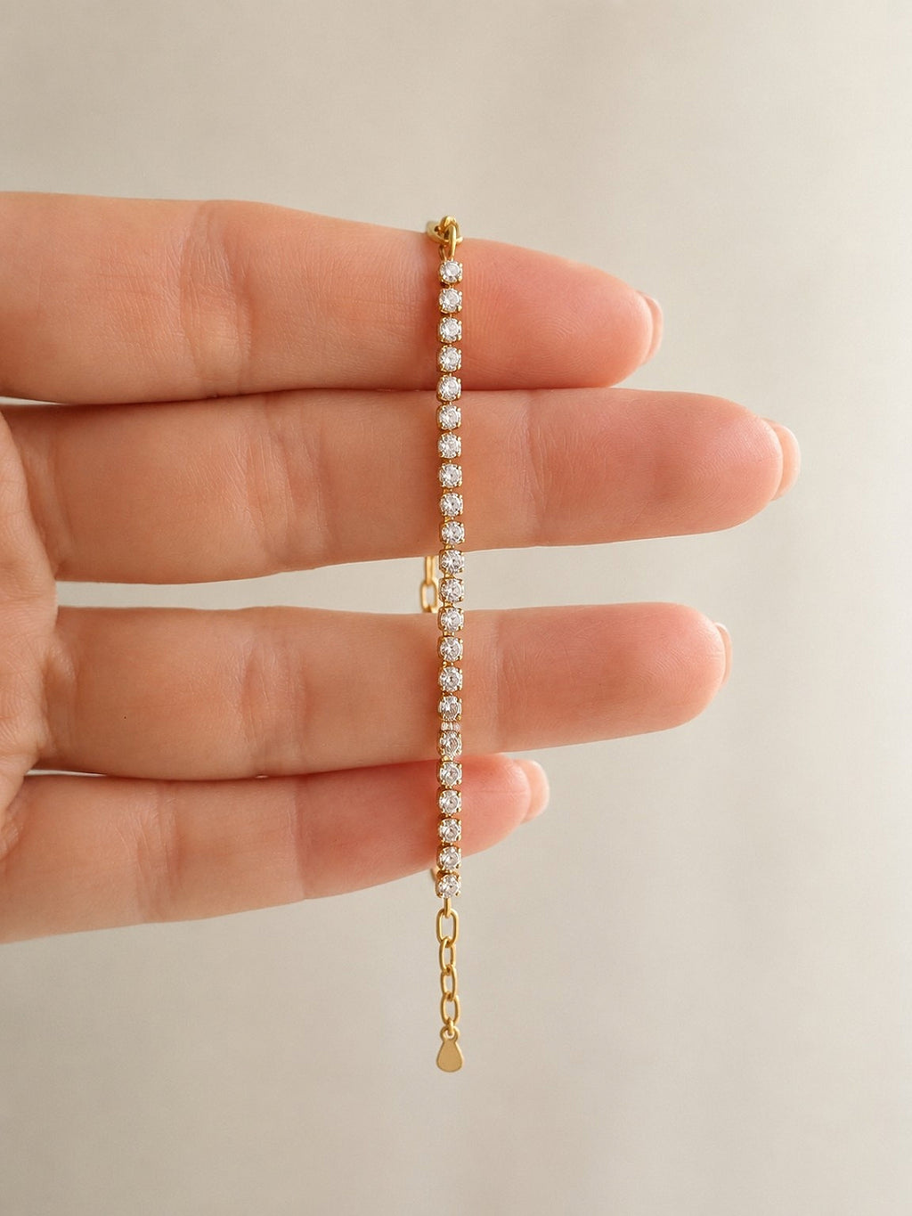 Waterproof gold tennis bracelet for women.