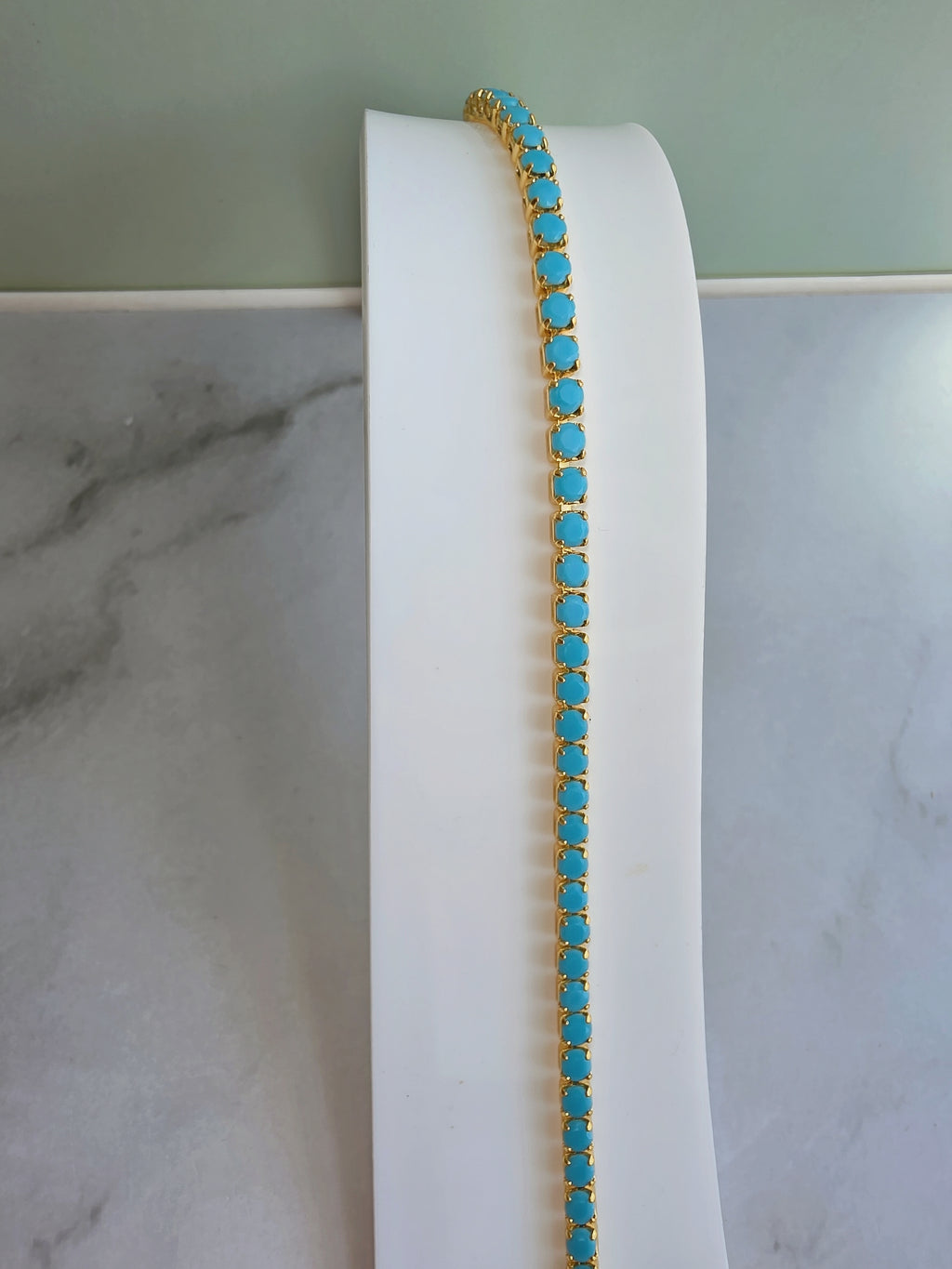 Silver turquoise tennis choker with sparkling CZ stones.