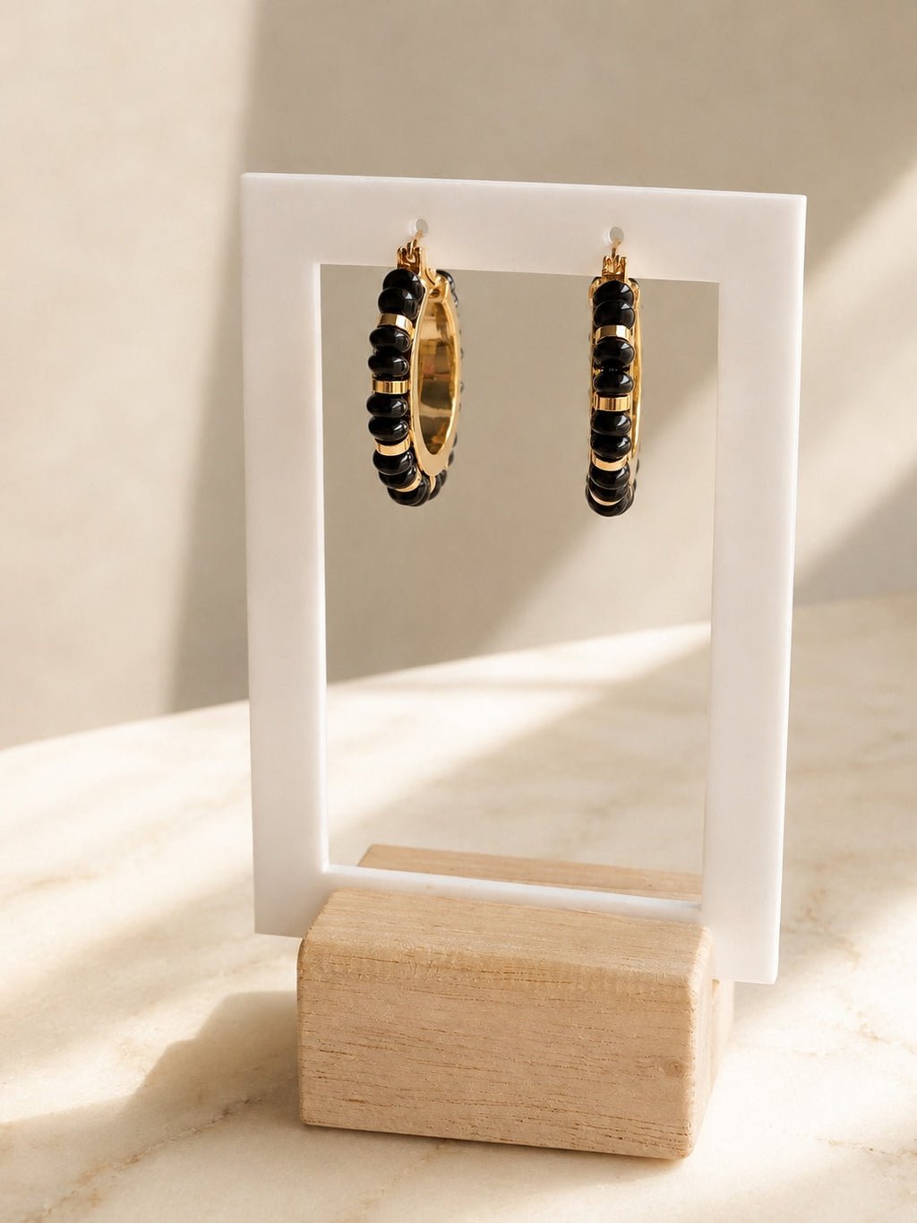 Black onyx statement earrings with glossy bead details