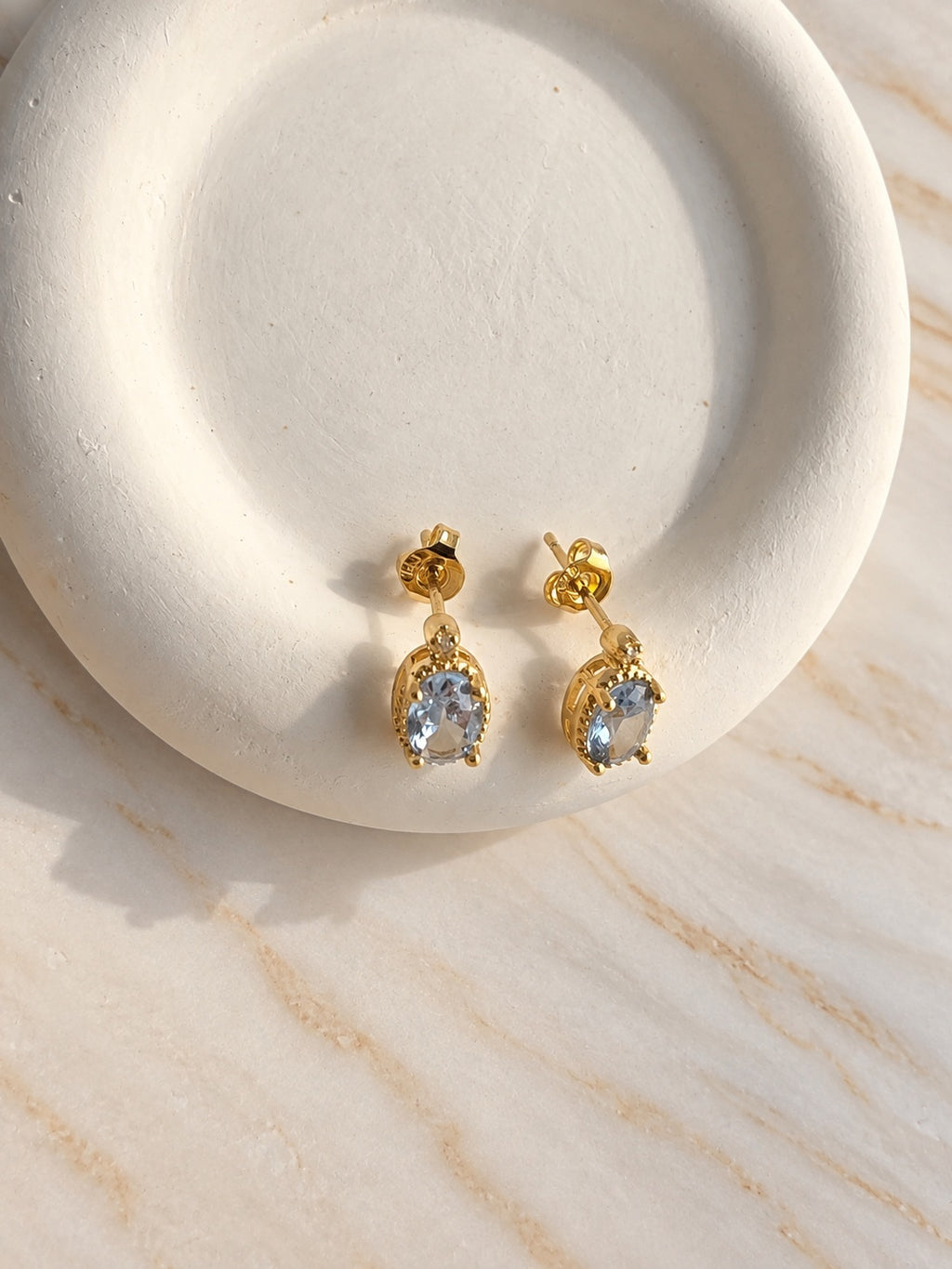Blue aquamarine earrings in elegant gold-plated setting