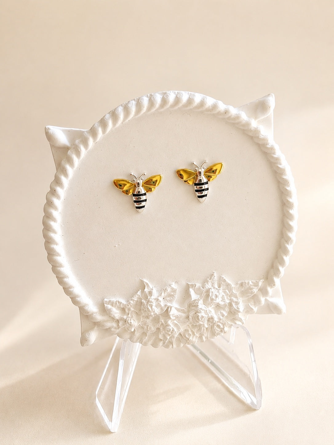 Nature-inspired bee stud earrings.