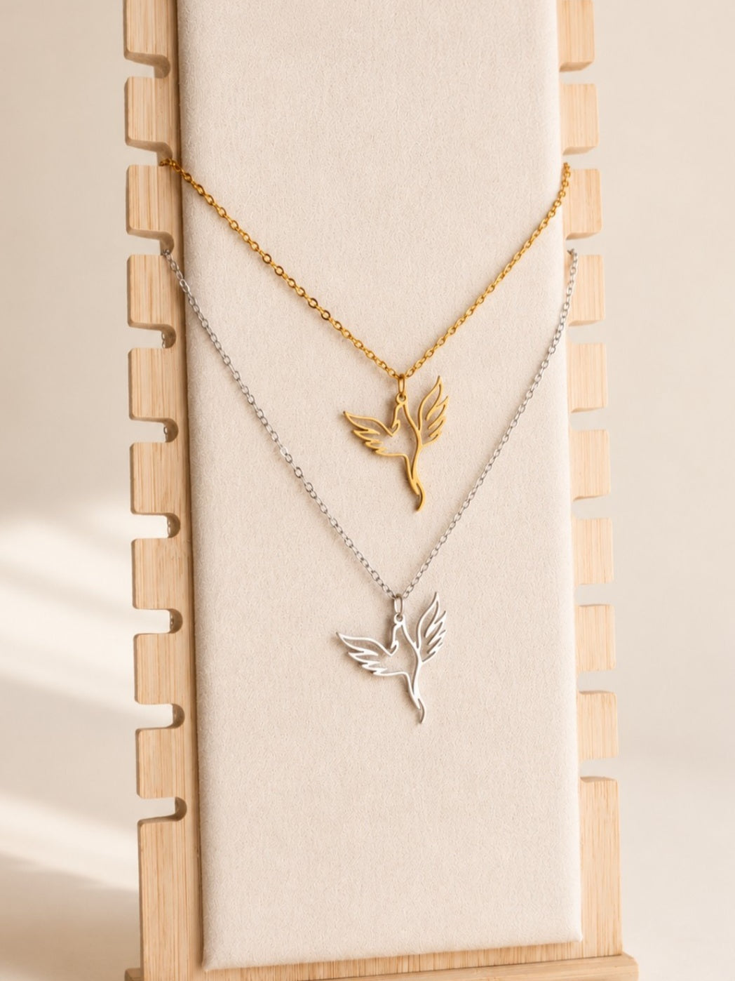 Non tarnish phoenix necklace with an 18K gold-plated stainless steel pendant.