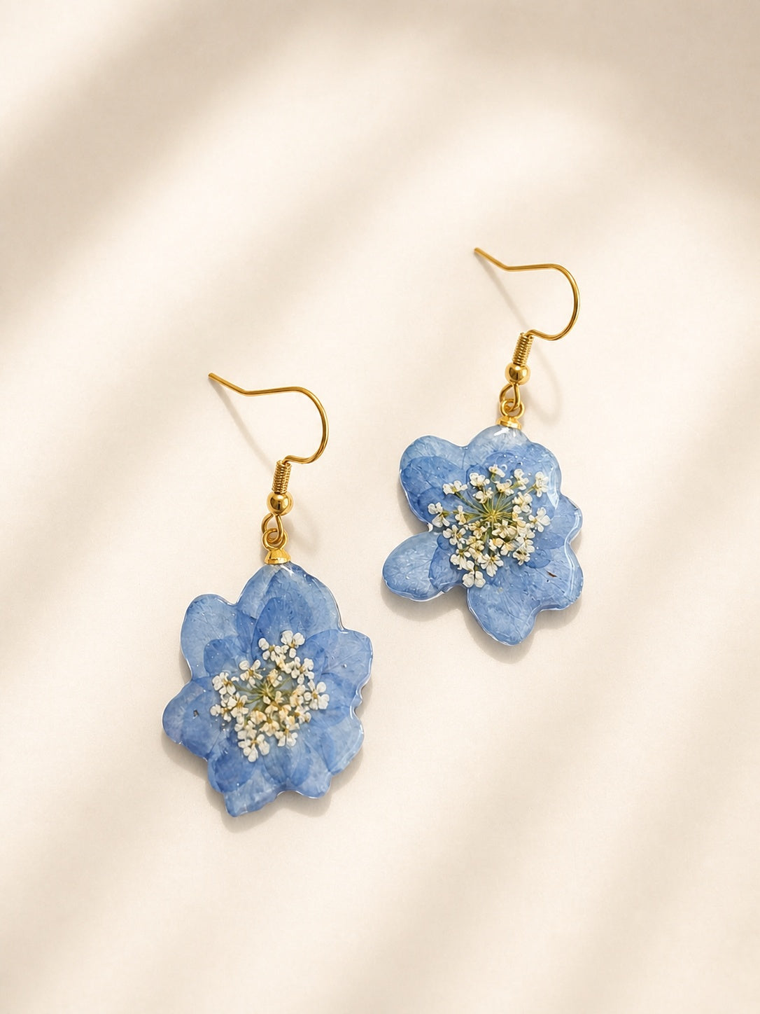 Blue hydrangea pressed flower earrings handcrafted with real flowers.