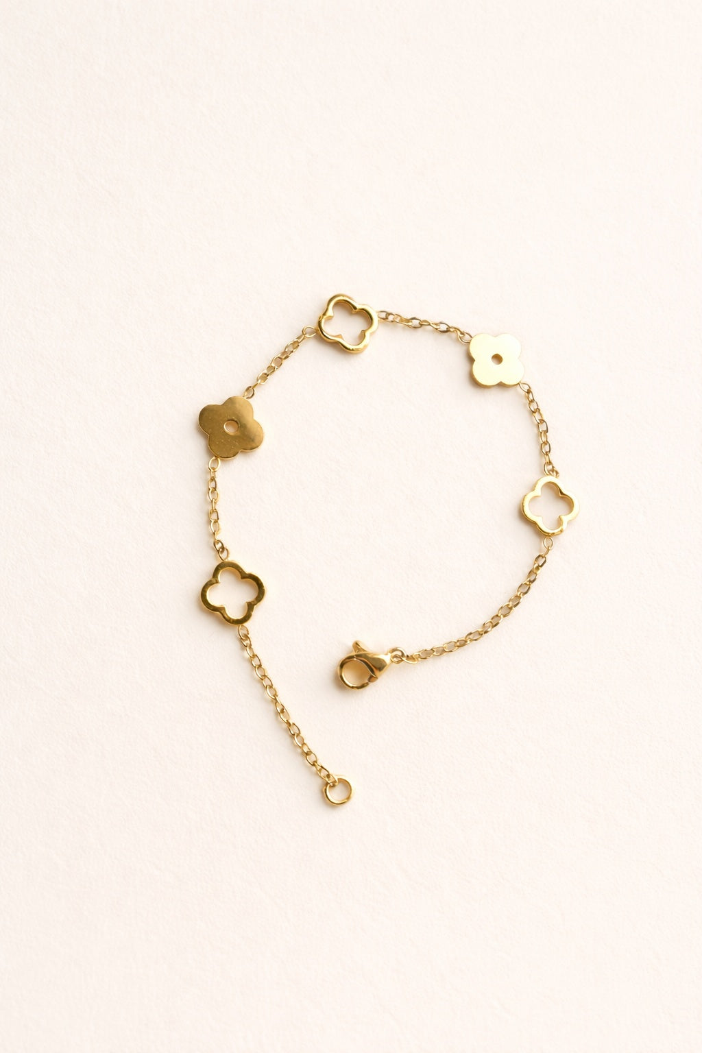 Gold Clover Bracelet with an 18K gold-plated finish and adjustable chain.