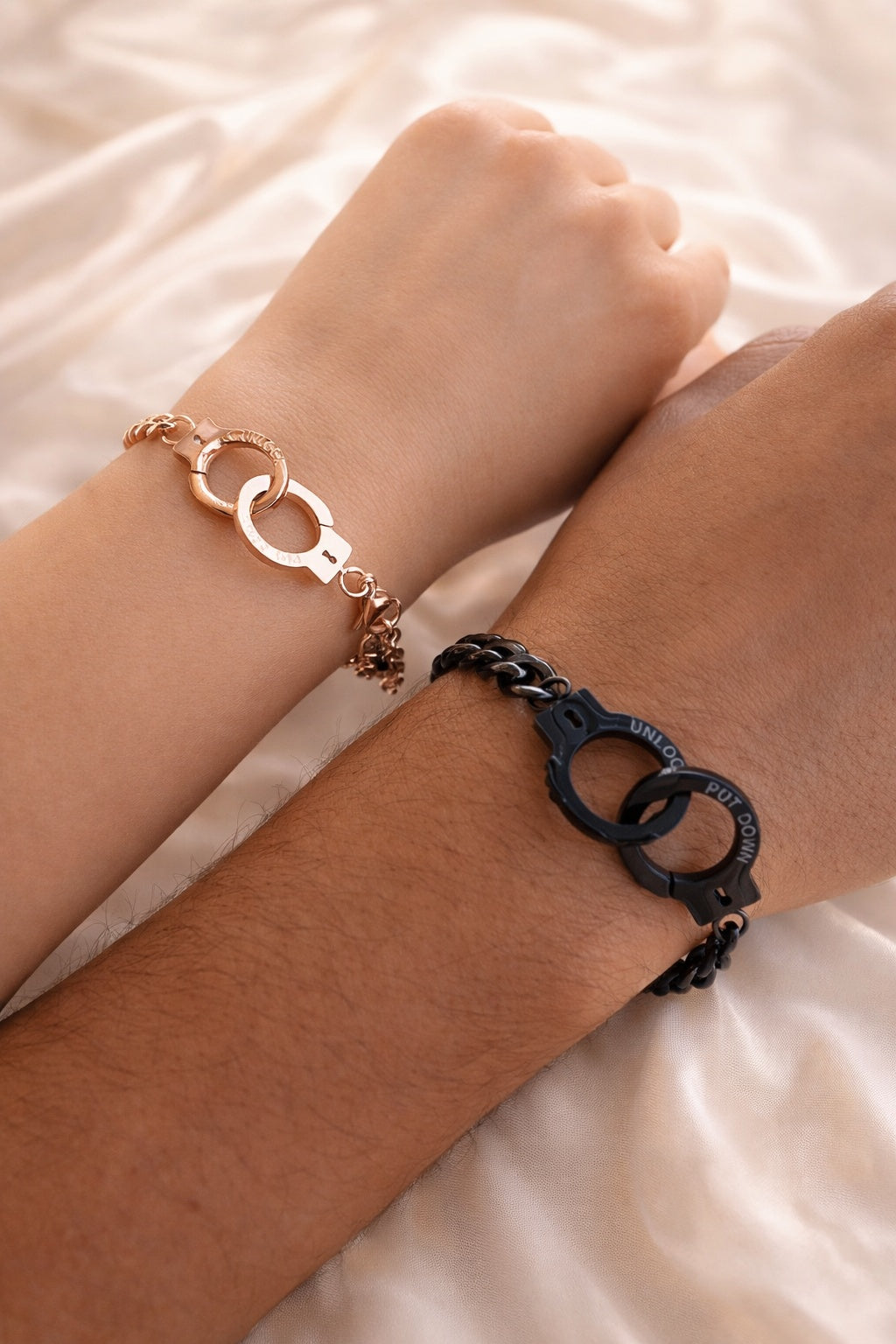 Adjustable matching couple bracelets with a sleek handcuff-inspired design.