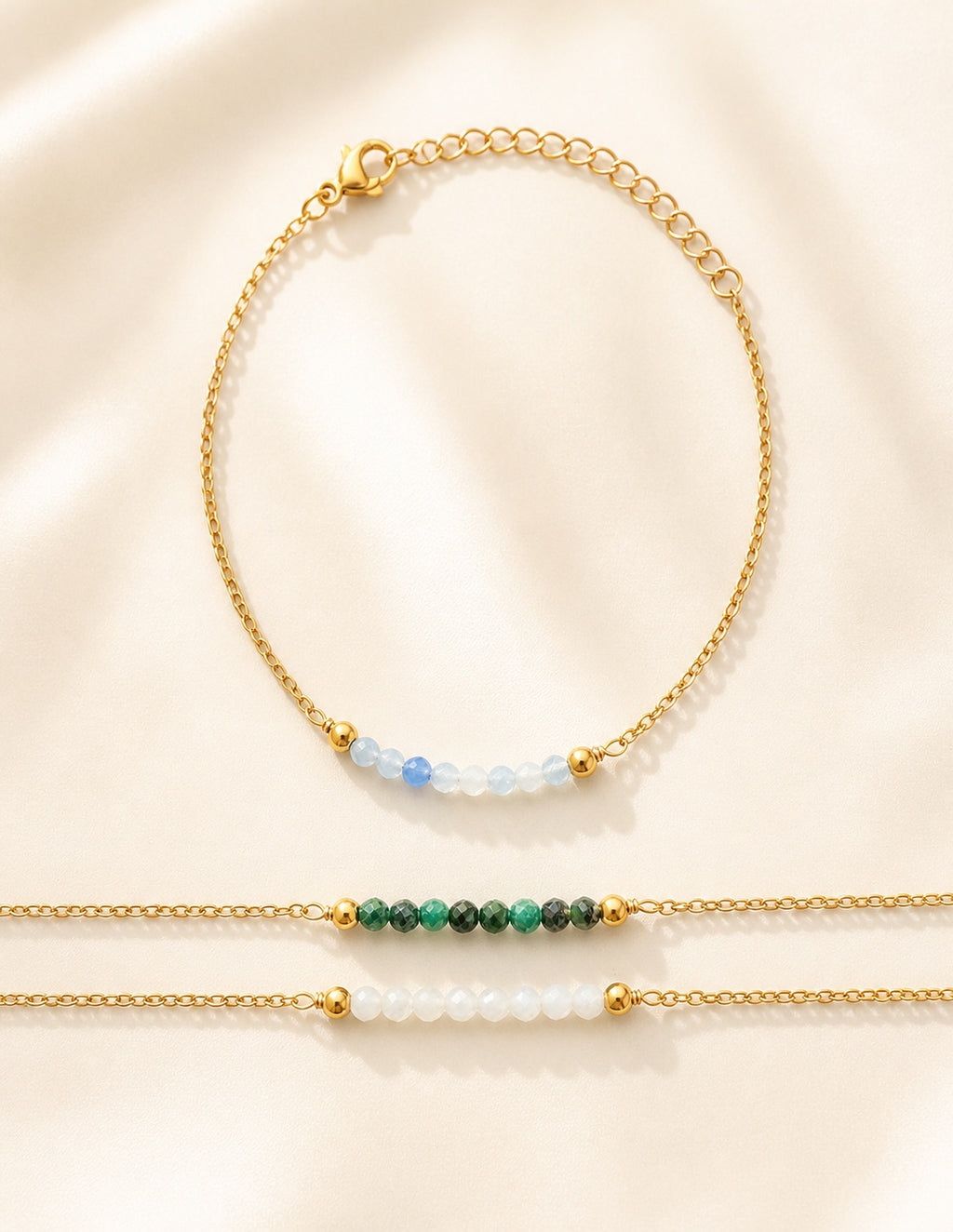 Beaded aquamarine bracelet with an adjustable 18K gold-plated chain.