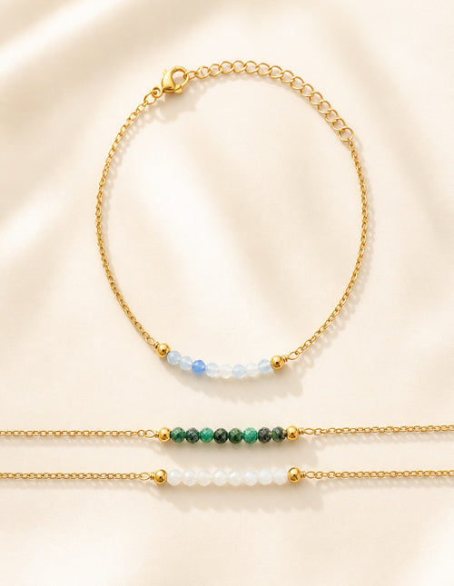 Beaded aquamarine bracelet with an adjustable 18K gold-plated chain.