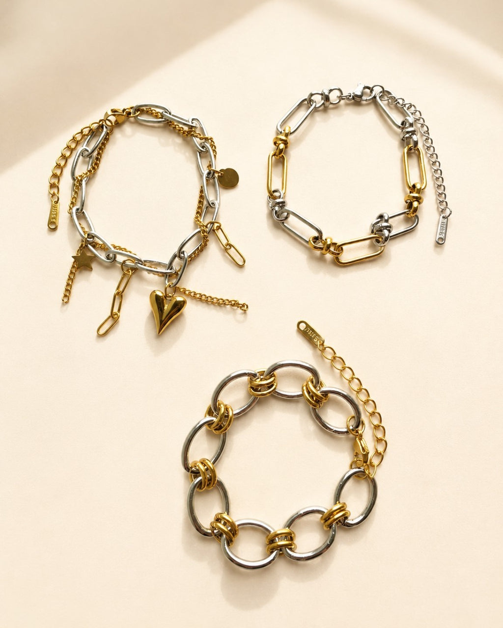 Chunky mixed metal paperclip bracelet with 18K gold plating.