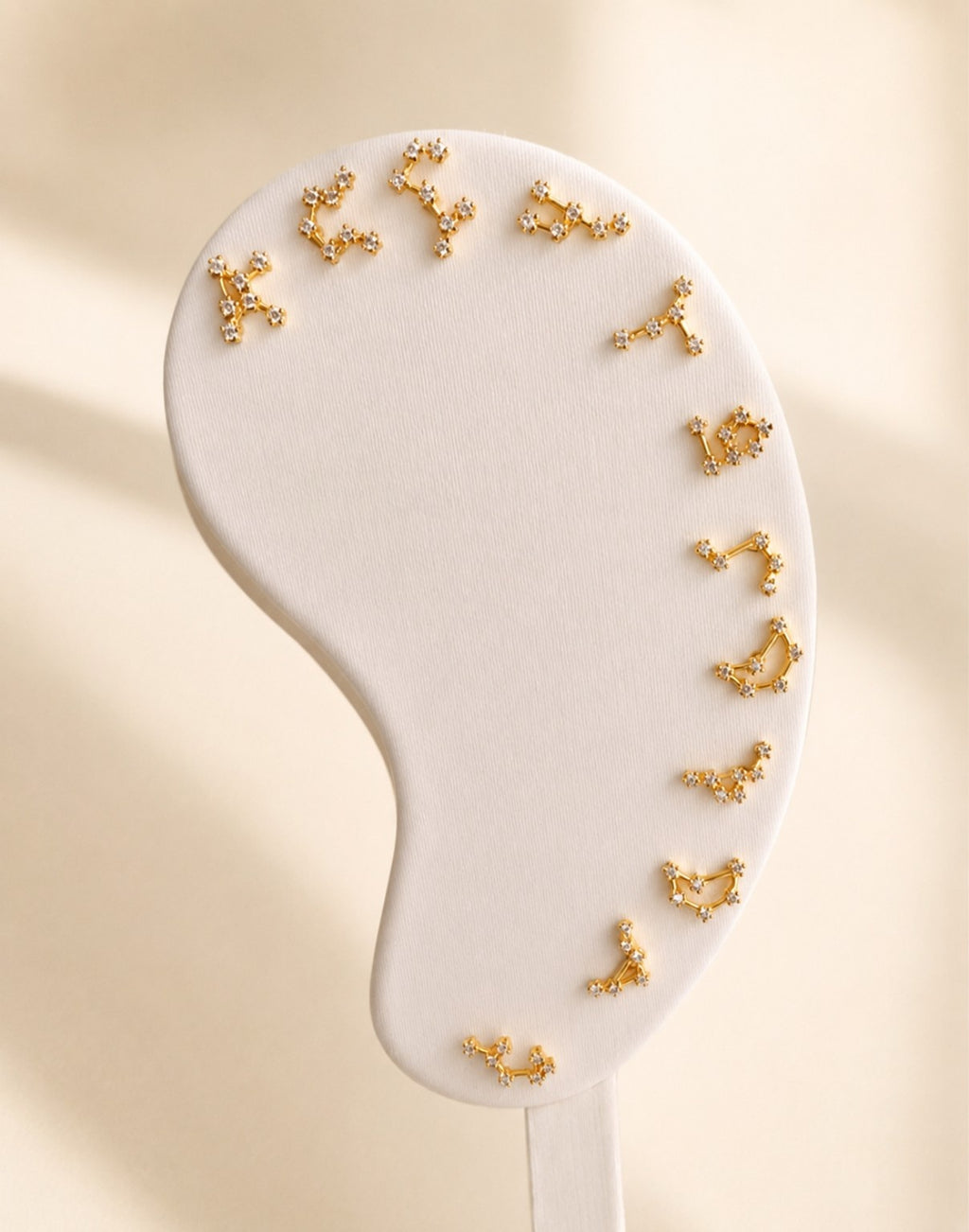 Zodiac constellation earrings crafted from 925 sterling silver with 14K gold plating.