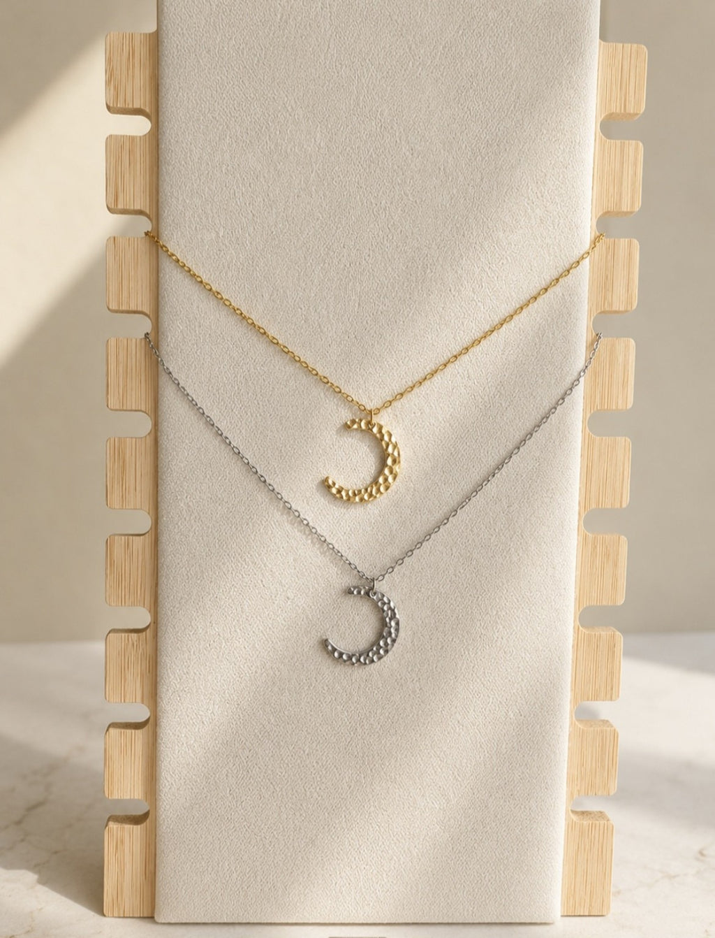 Elegant crescent moon necklace crafted from 18K gold-plated stainless steel with a celestial moon pendant.