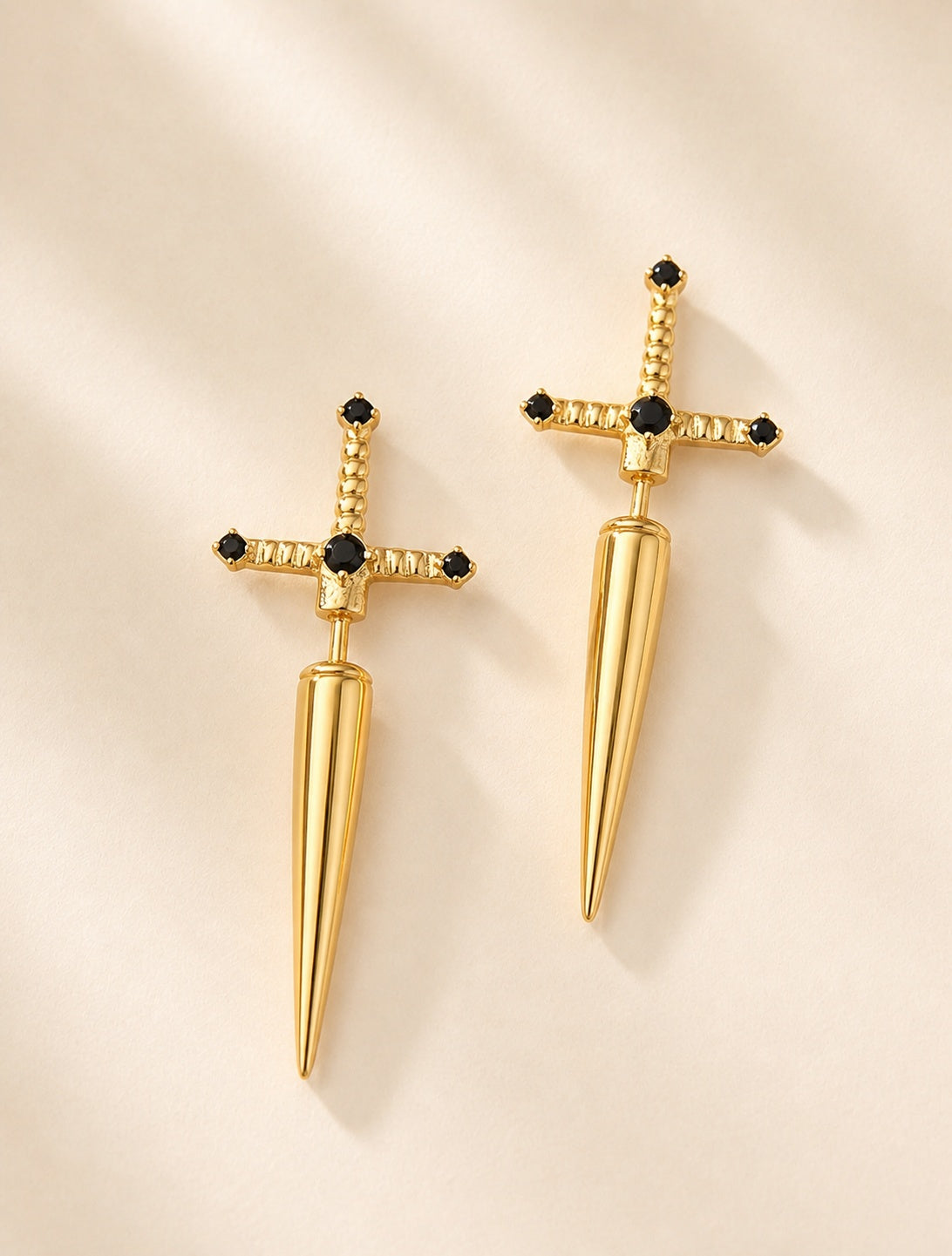 Dainty sword earrings featuring polished 18K gold-plated sterling silver.